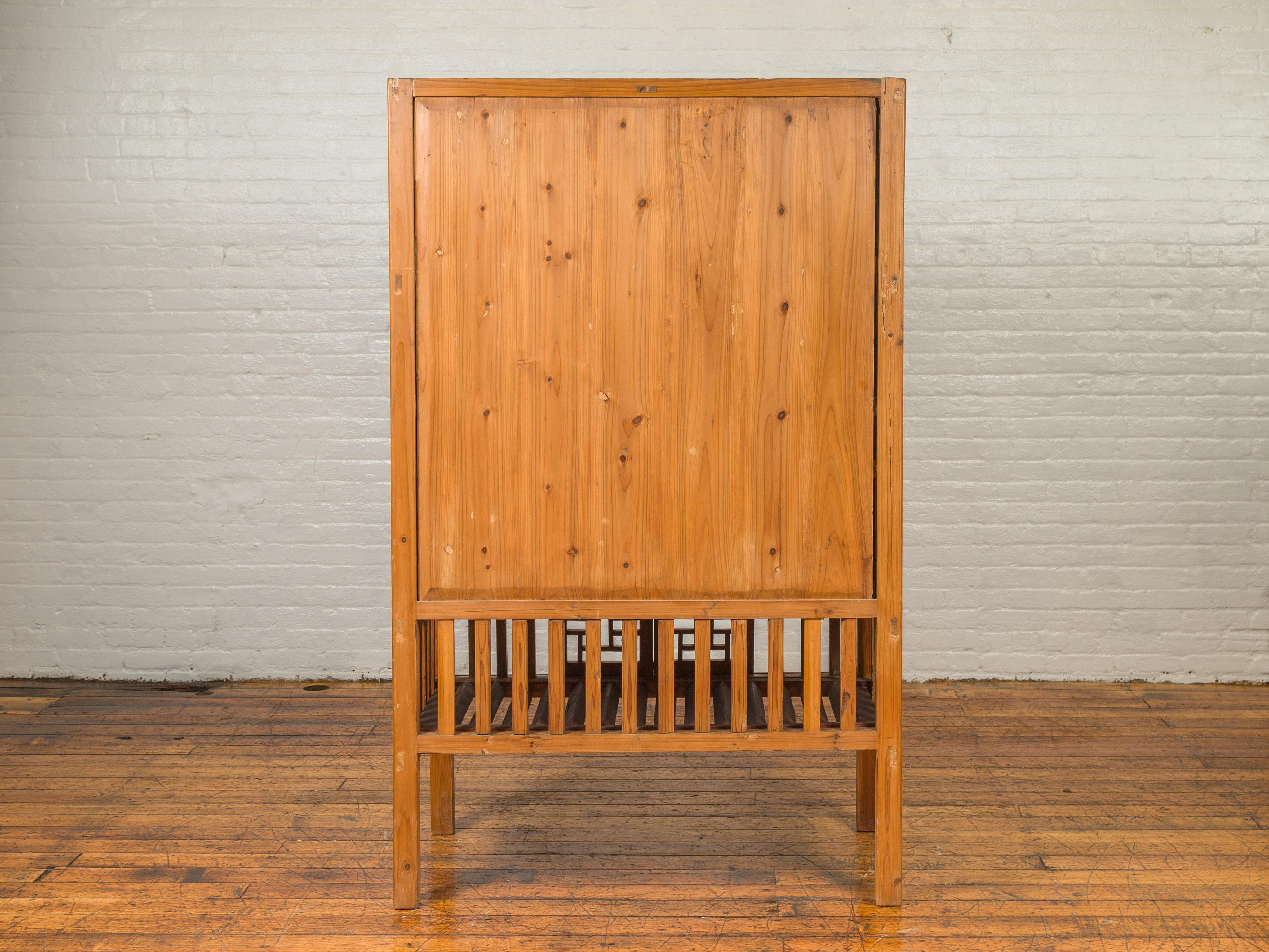 Chinese Qing Dynasty Elm Kitchen Cabinet with Fretwork Motifs and Sliding Panels 8