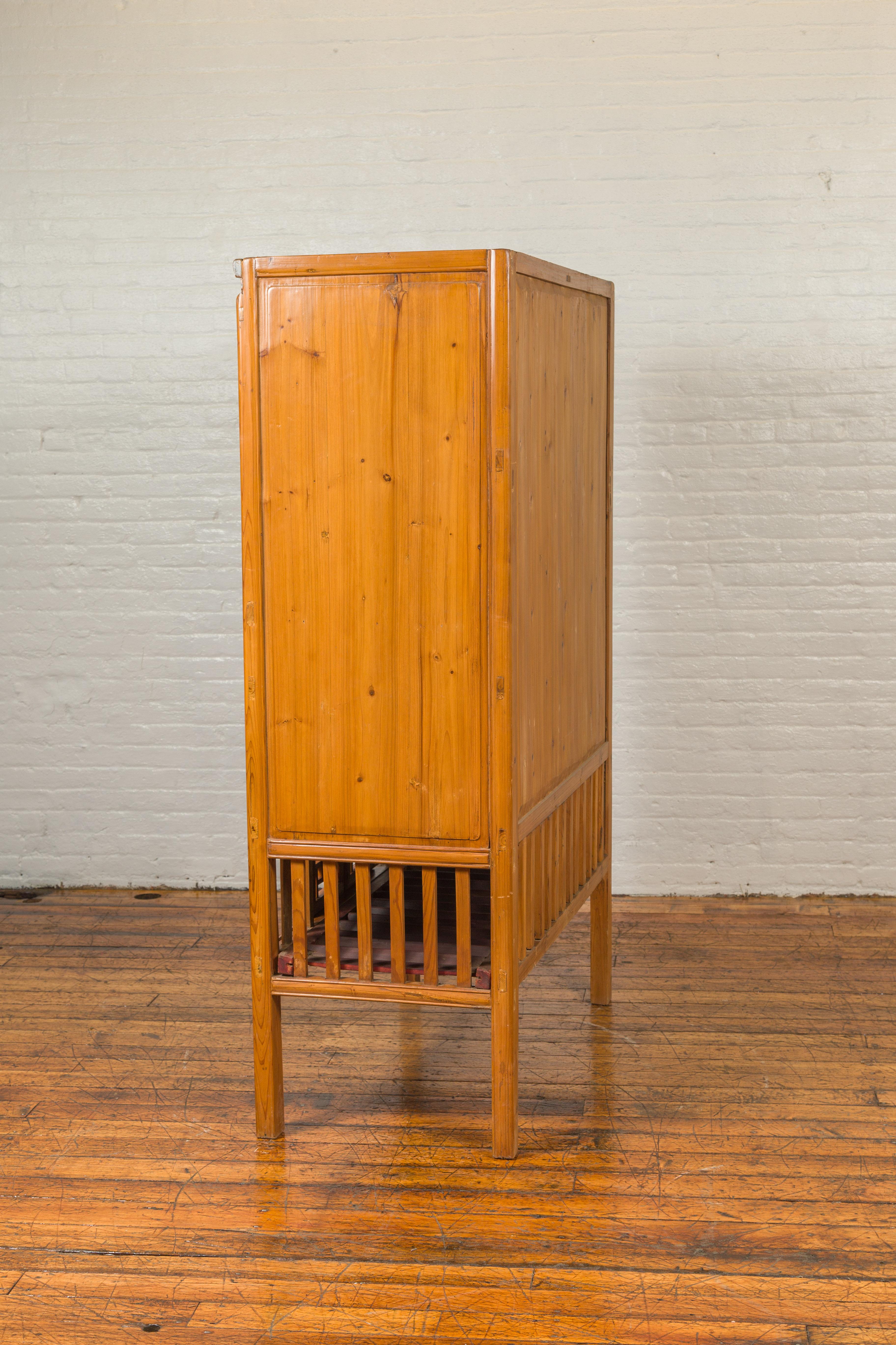 Chinese Qing Dynasty Elm Kitchen Cabinet with Fretwork Motifs and Sliding Panels 9