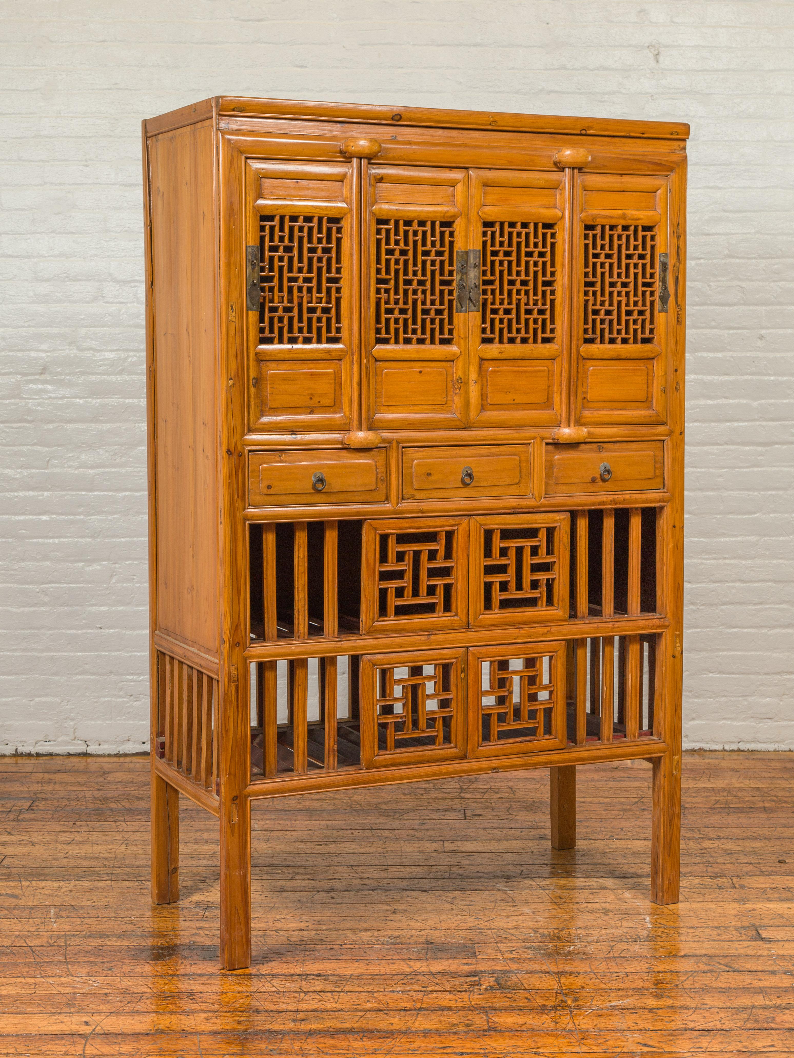Chinese Qing Dynasty Elm Kitchen Cabinet with Fretwork Motifs and Sliding Panels In Good Condition In Yonkers, NY