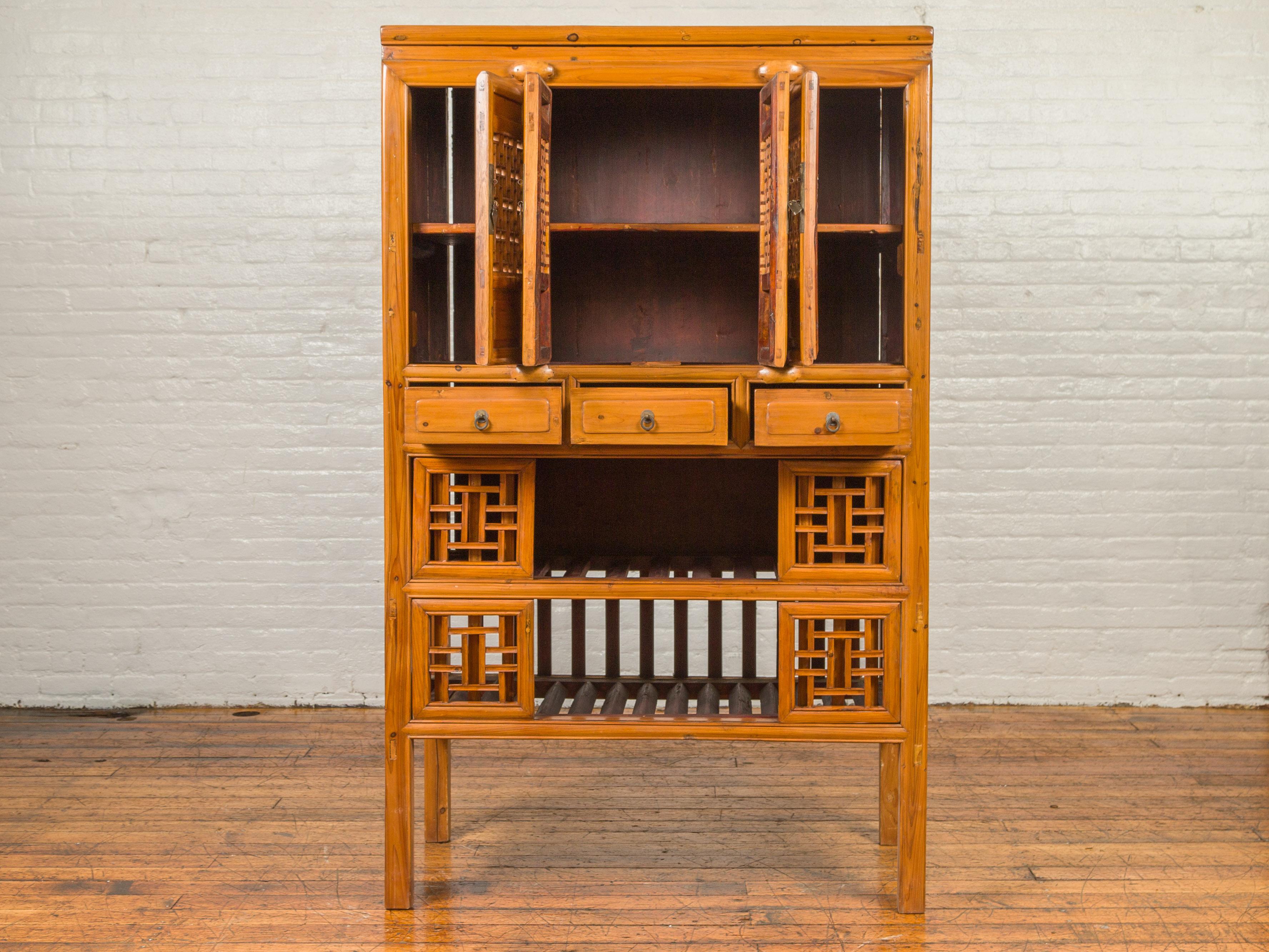 19th Century Chinese Qing Dynasty Elm Kitchen Cabinet with Fretwork Motifs and Sliding Panels