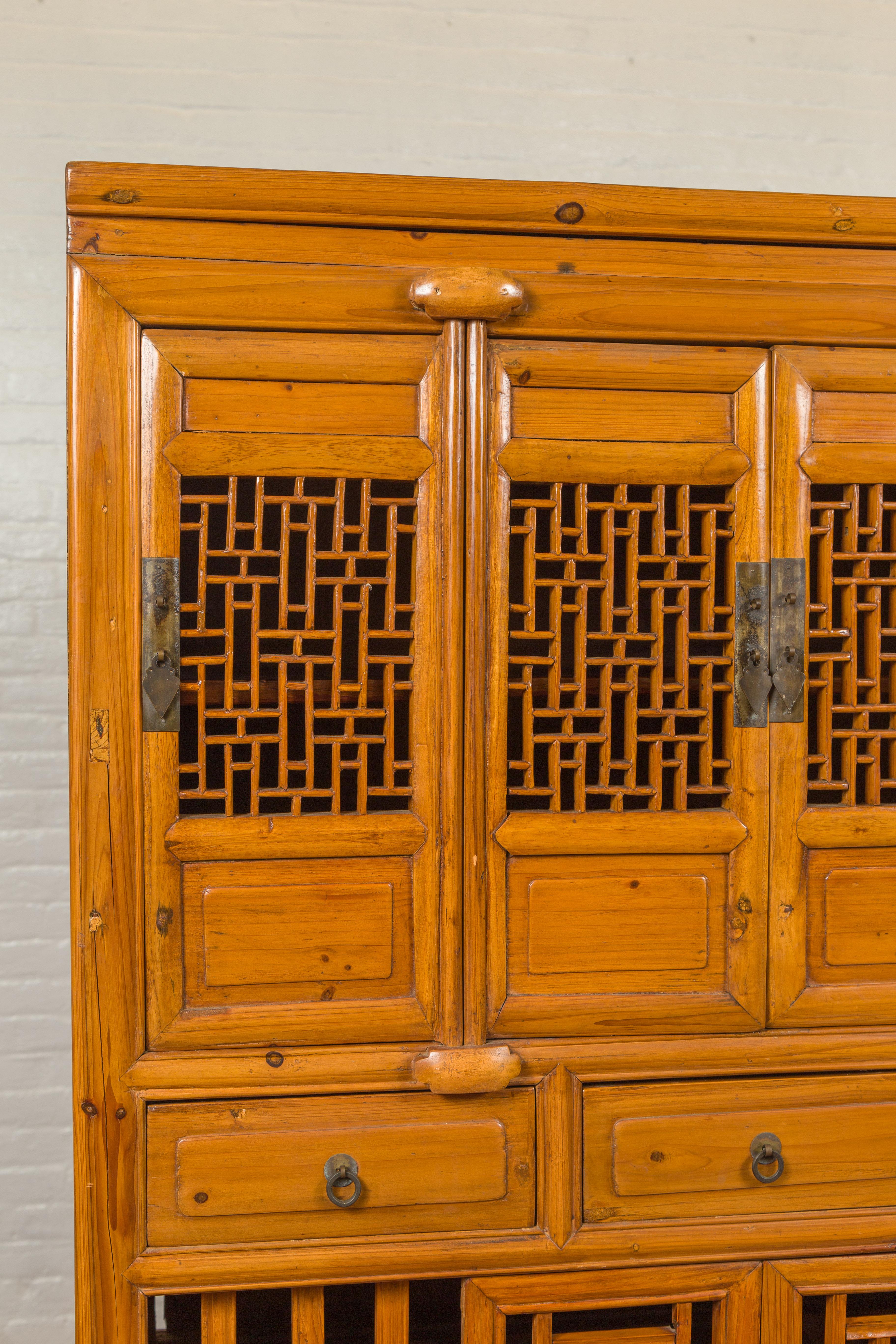 Chinese Qing Dynasty Elm Kitchen Cabinet with Fretwork Motifs and Sliding Panels 1