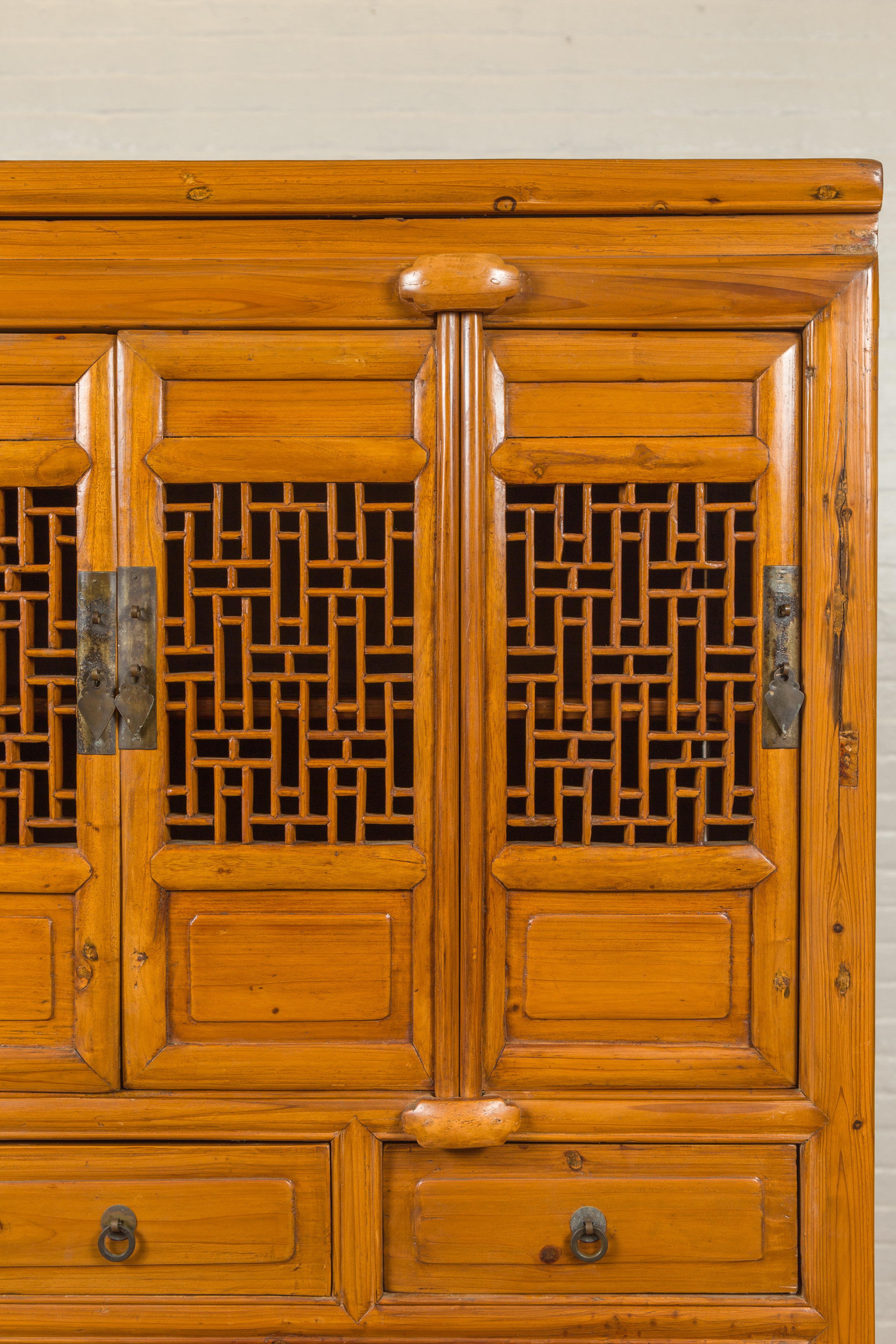 Chinese Qing Dynasty Elm Kitchen Cabinet with Fretwork Motifs and Sliding Panels 2