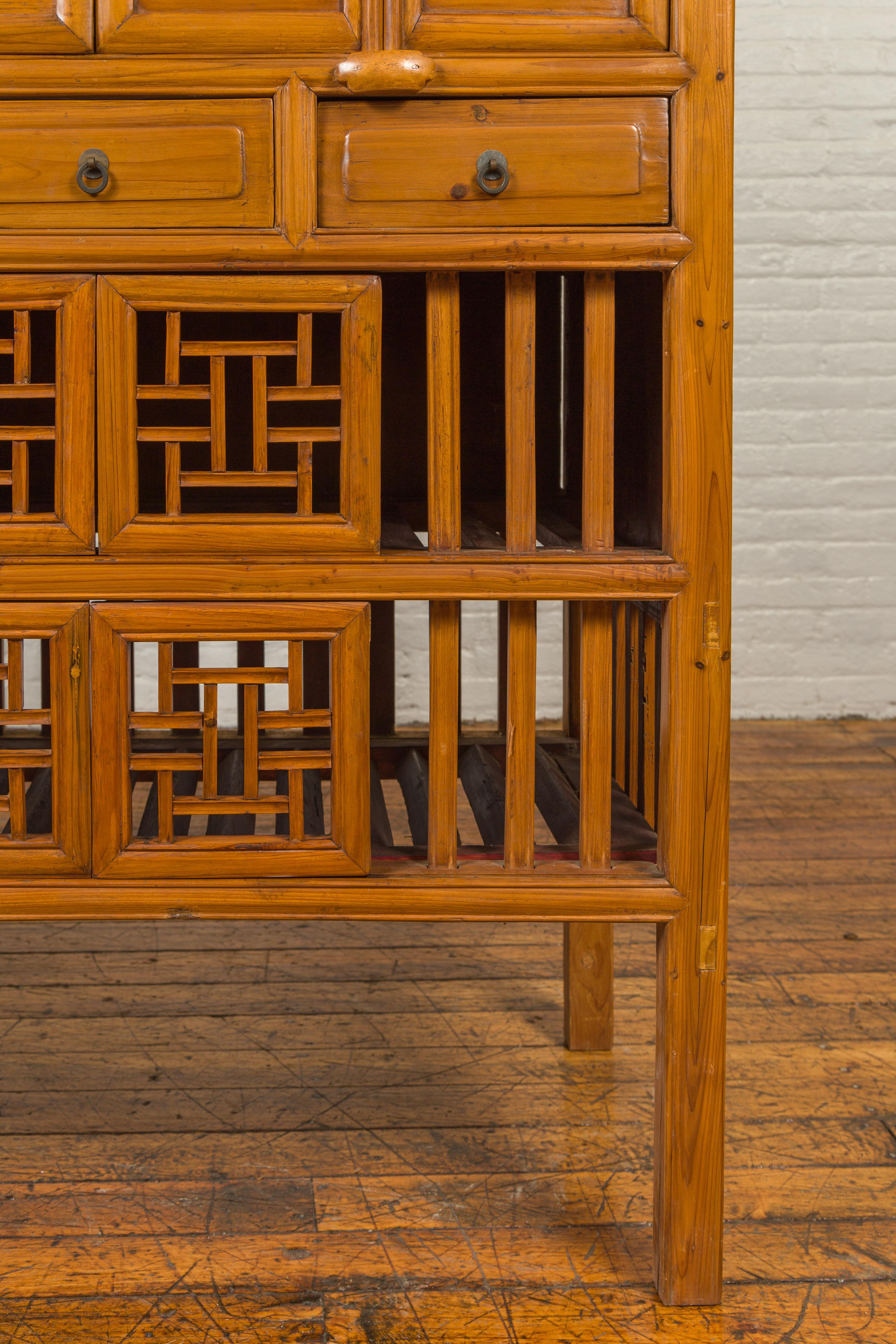 Chinese Qing Dynasty Elm Kitchen Cabinet with Fretwork Motifs and Sliding Panels 4