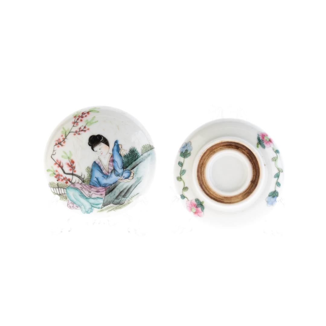 This exquisite Chinese Qing Dynasty famille rose porcelain lidded box, dating to the 19th century, is a captivating example of the delicate artistry and vibrant craftsmanship that defines the period. Adorned with intricate hand-painted floral
