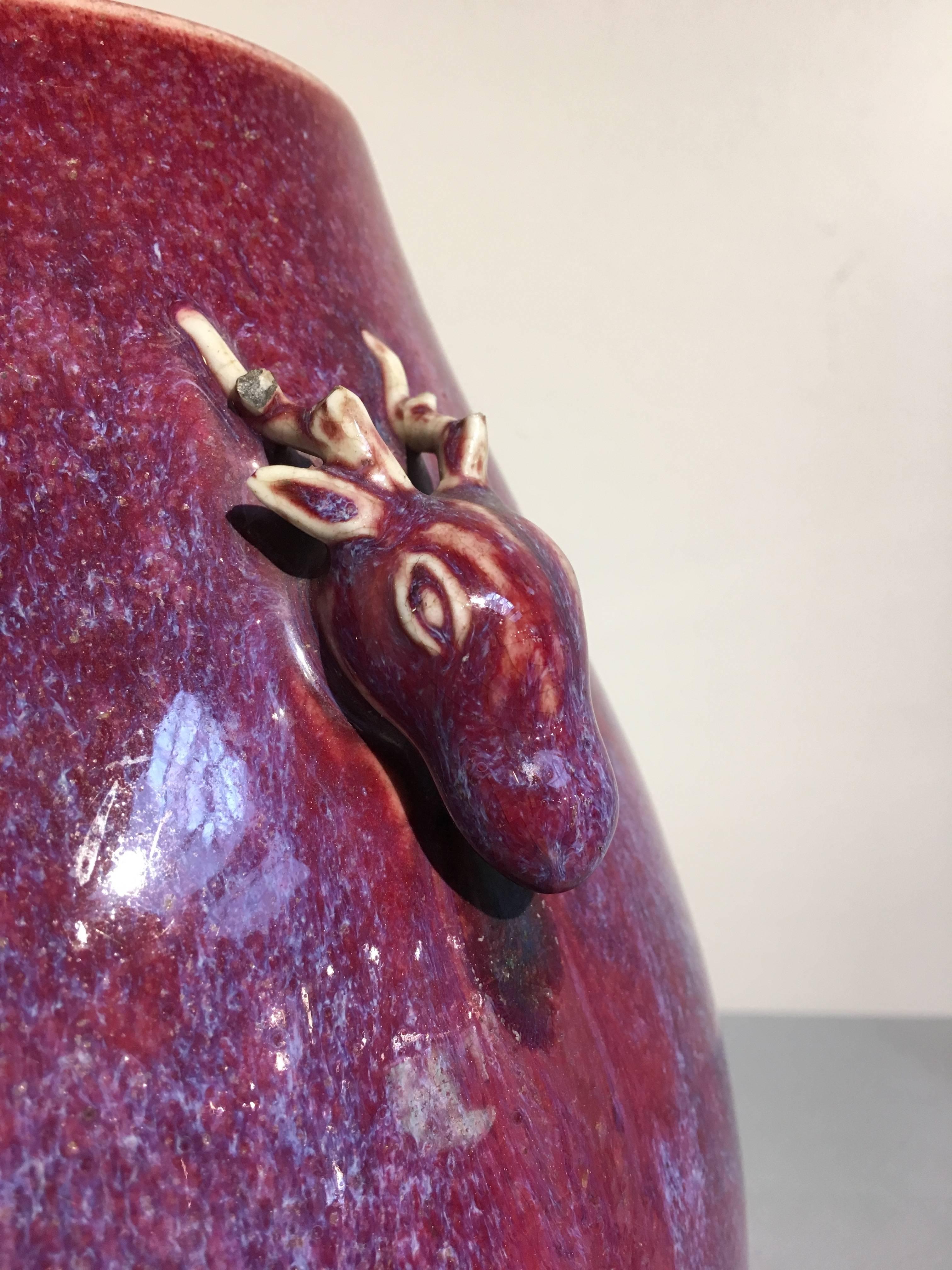 Stoneware Chinese Qing Dynasty Flambe Glazed Archaistic Hu Vase with Deer Head Handles For Sale