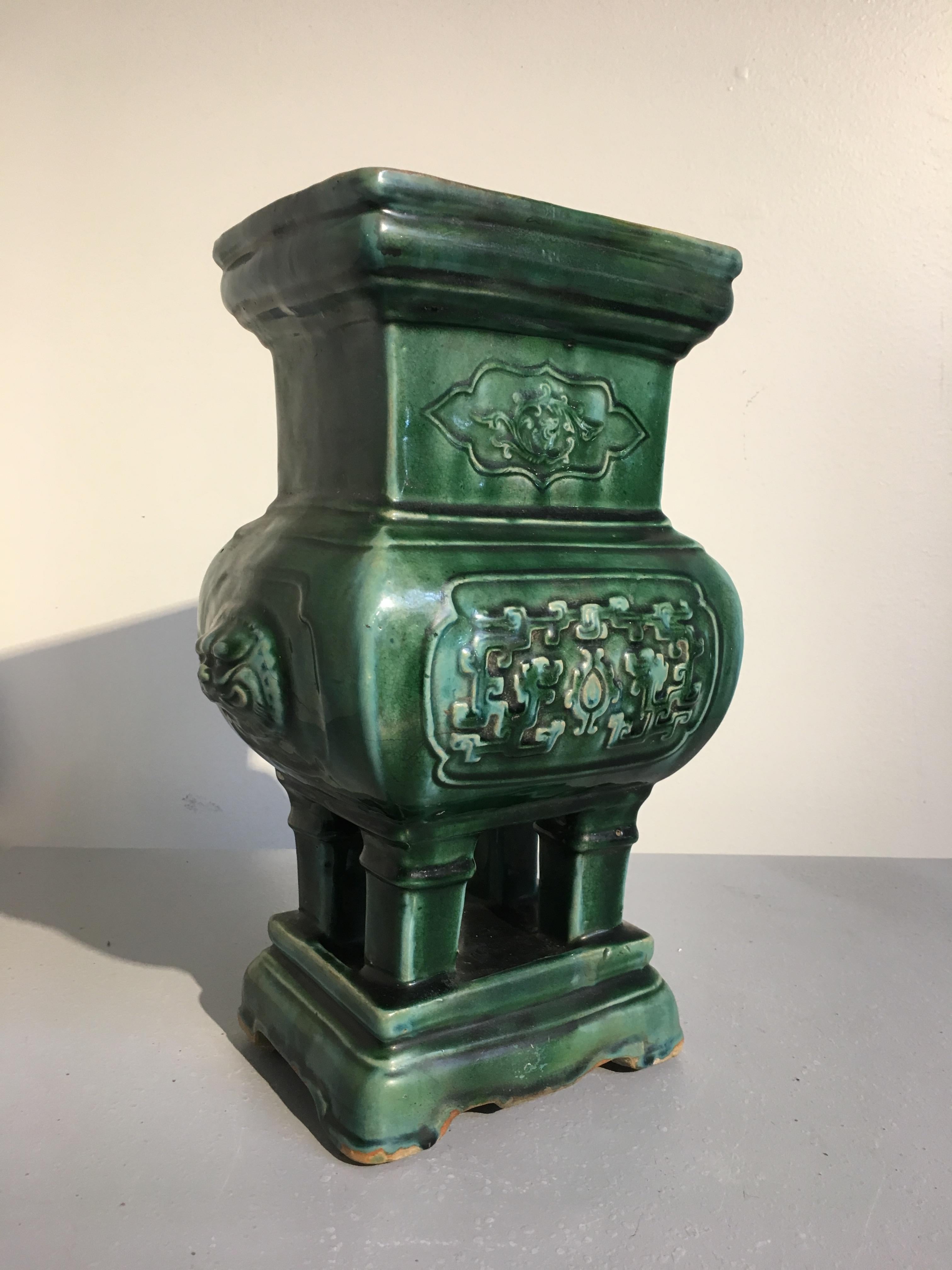 A charming Chinese green glazed pottery censer or incense burner, Qing Dynasty, late 19th century. Now suitable for use as a jardiniere or vase.
The incense burner in glazed a deep green, in imitation of bronze models, and set on four tapered legs