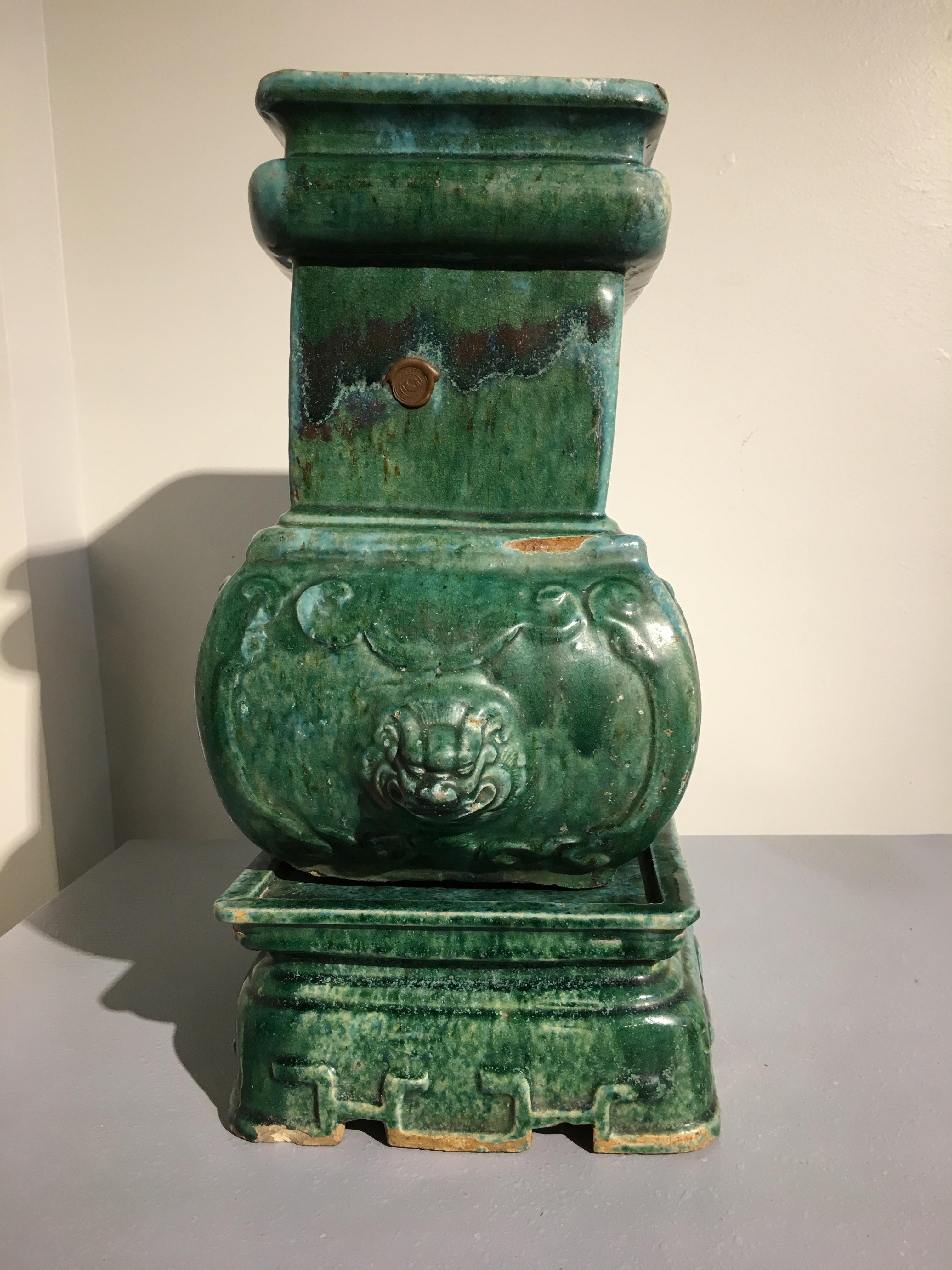 A gorgeous green glazed large Chinese pottery censer of Archaistic shape called a fanghu, set on a separate stand, Qing dynasty, second year of Tongzhi, 1863.

The censer or incense burner crafted in two parts and covered in a thick, runny and