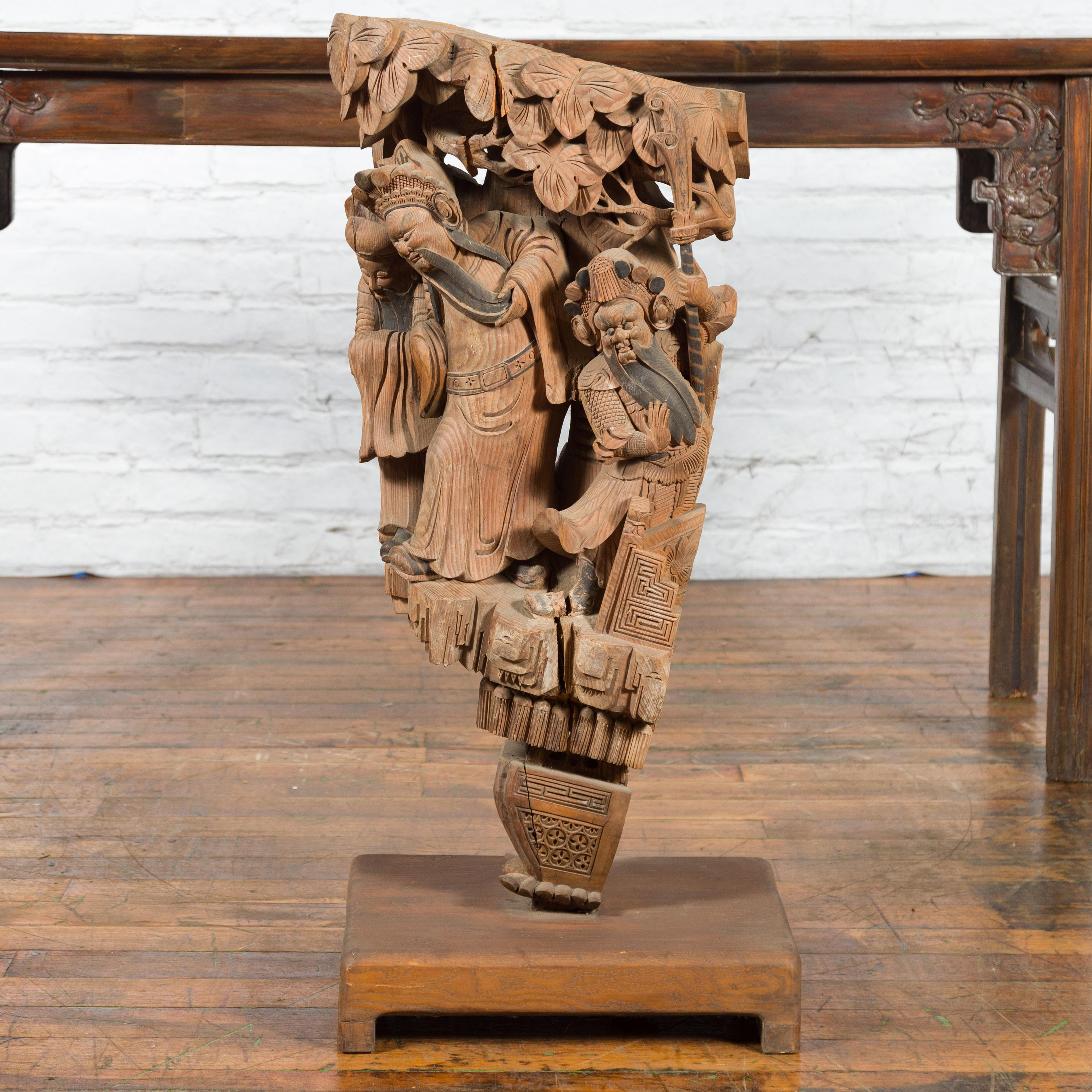 Chinese Qing Dynasty Hand-Carved Wooden Temple Corbel with Detailed Figures For Sale 10