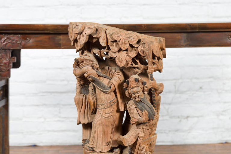 Chinese Qing Dynasty Hand-Carved Wooden Temple Corbel with Detailed Figures For Sale 1