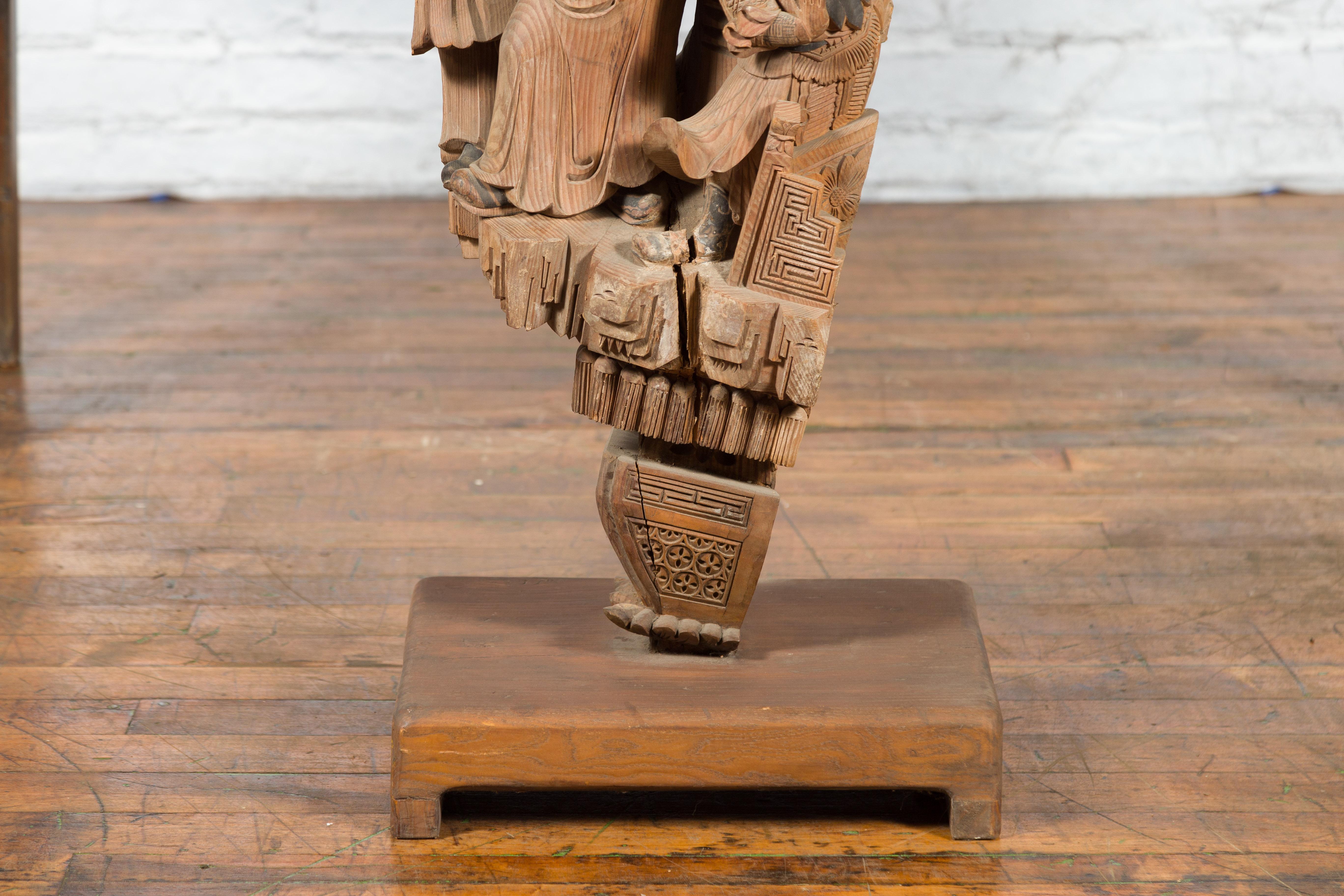 Chinese Qing Dynasty Hand-Carved Wooden Temple Corbel with Detailed Figures For Sale 1