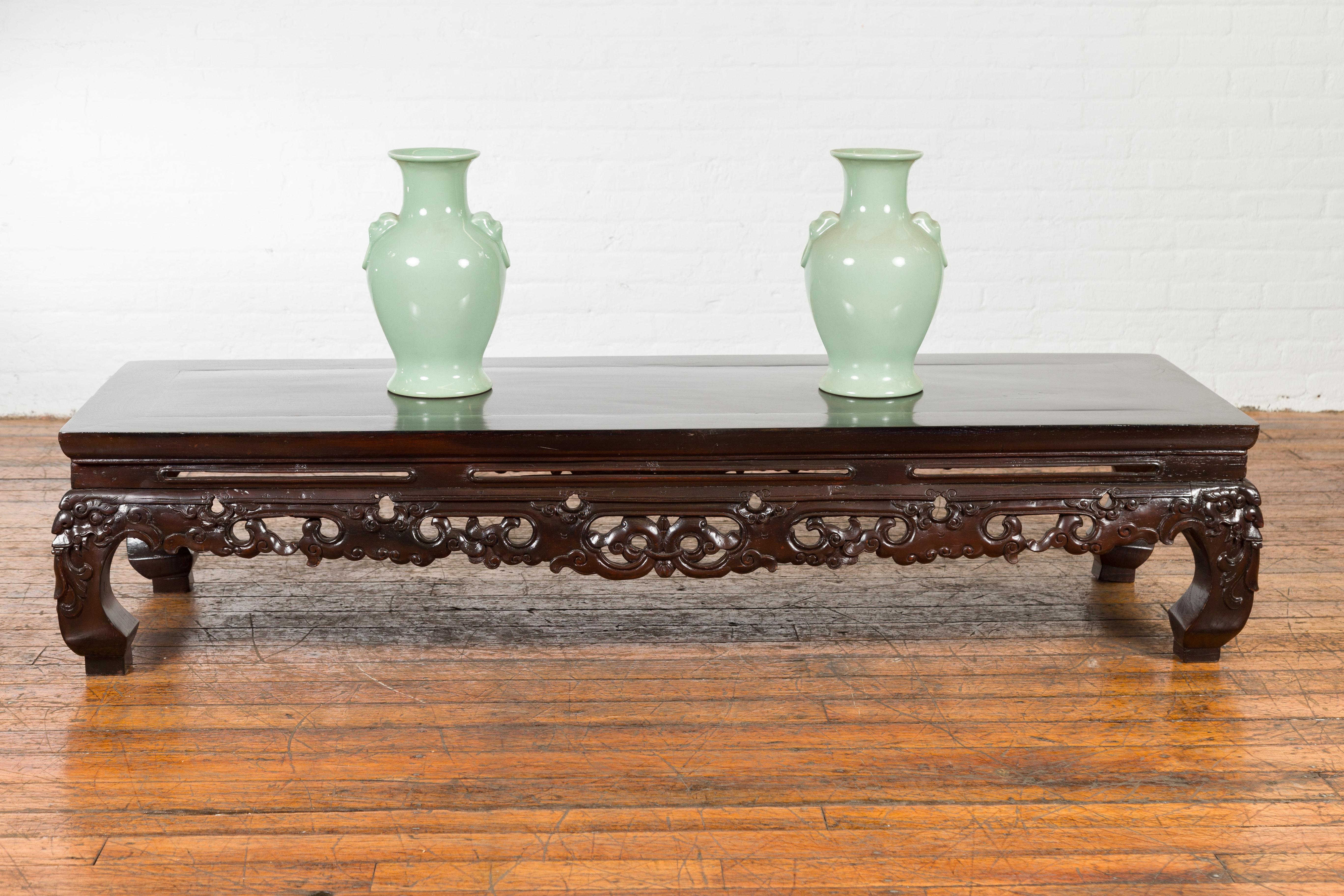 Chinese Qing Dynasty Low Kang Coffee Table with Carved Apron and Dark Lacquer For Sale