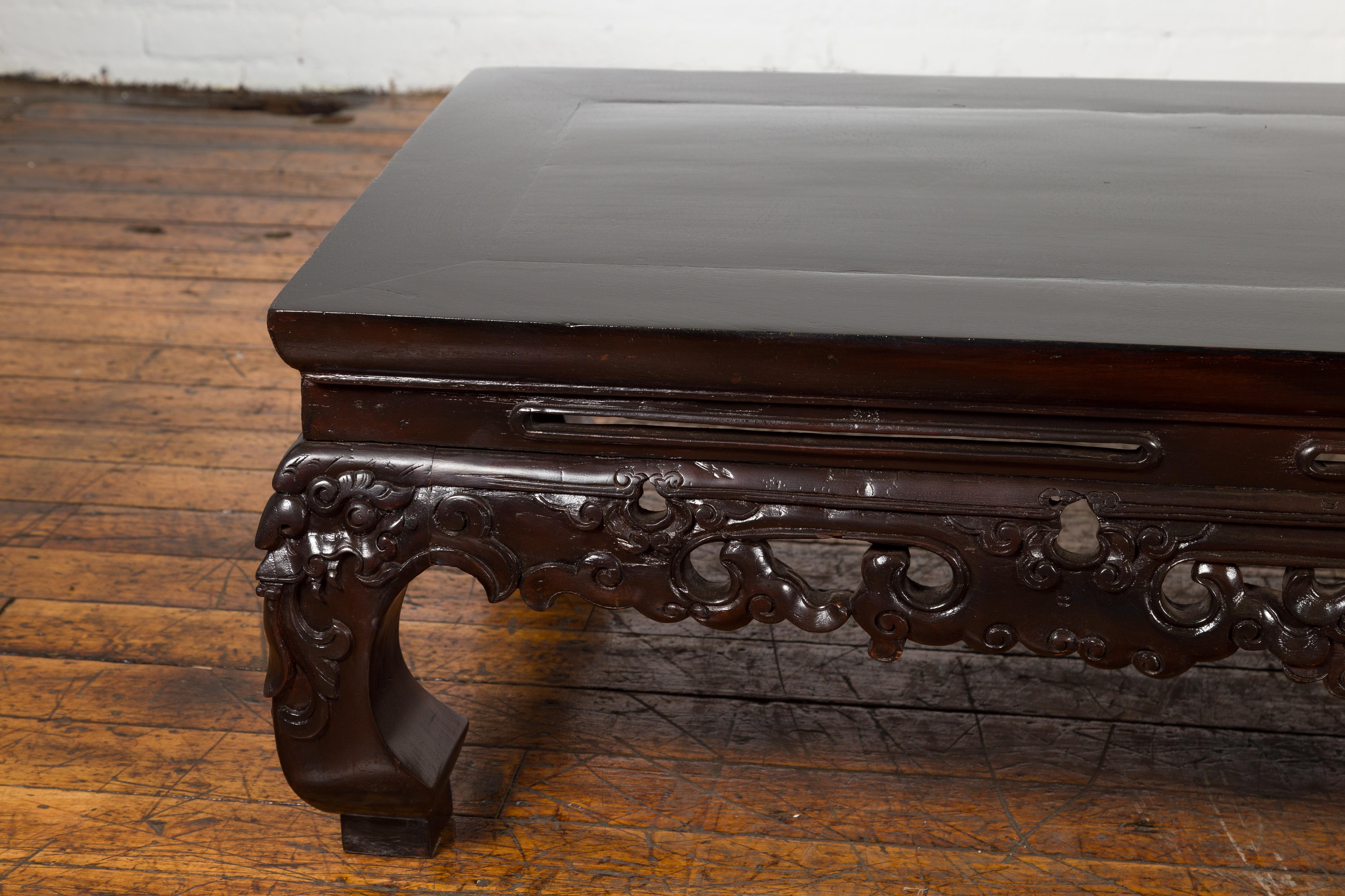 Wood Chinese Qing Dynasty Low Kang Coffee Table with Carved Apron and Dark Lacquer For Sale