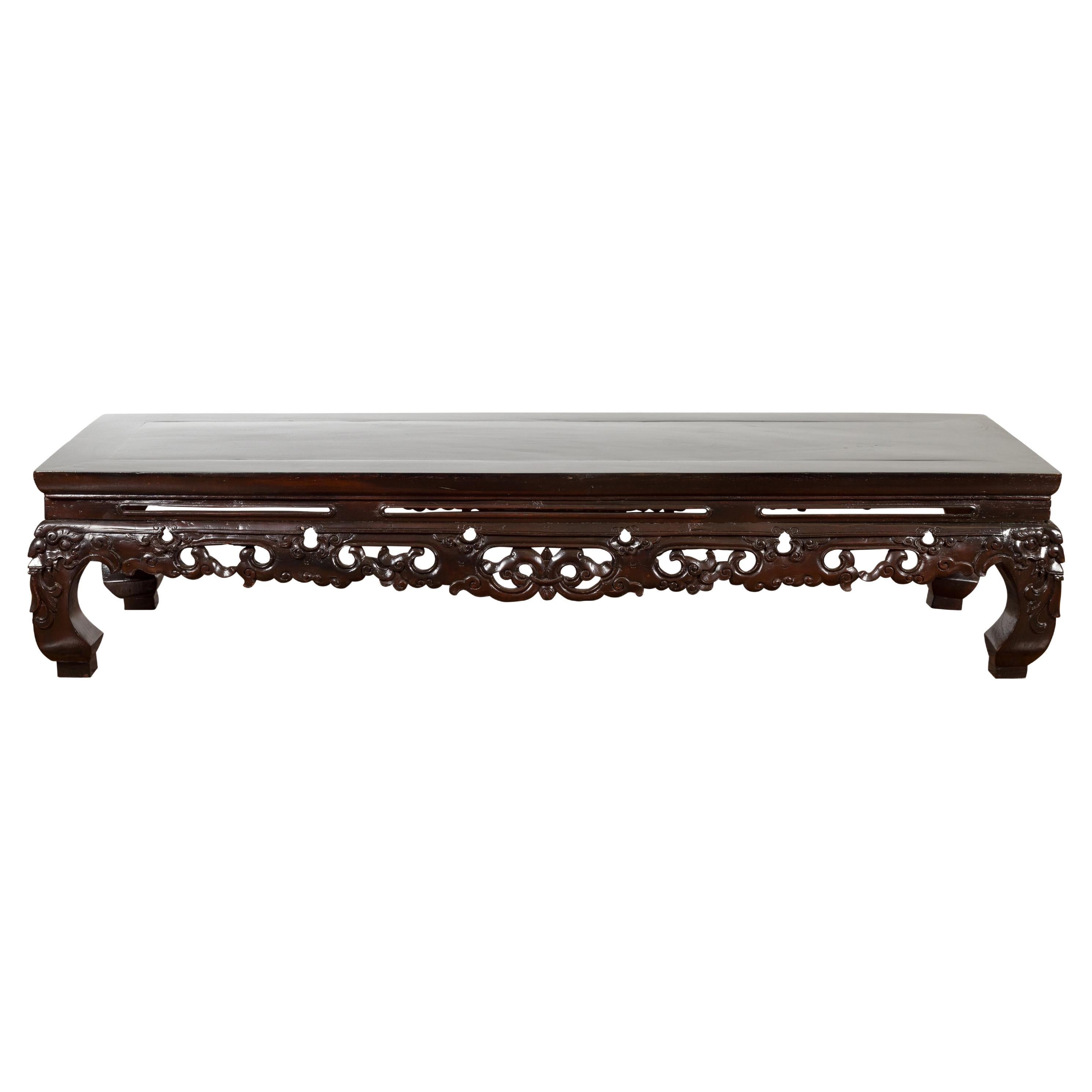 Chinese Qing Dynasty Low Kang Coffee Table with Carved Apron and Dark Lacquer For Sale
