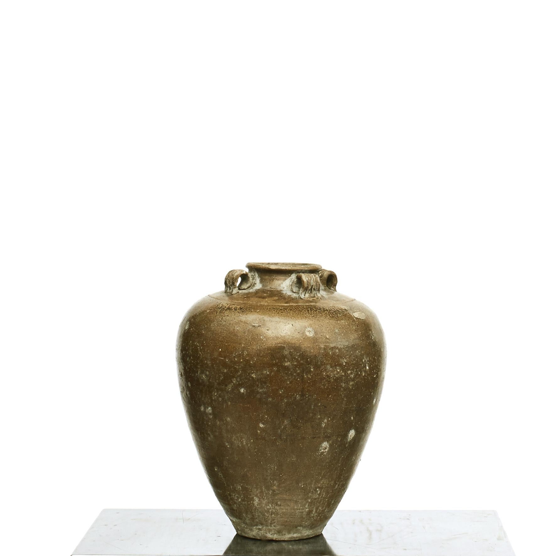 Chinese brown ochre glazed stoneware vinegar storage jar.
Decorative with god, natural patina,
China, 18-19th century.
Historically these jars were used to ferment and store vinegar in a Qing-dynasty kitchen.