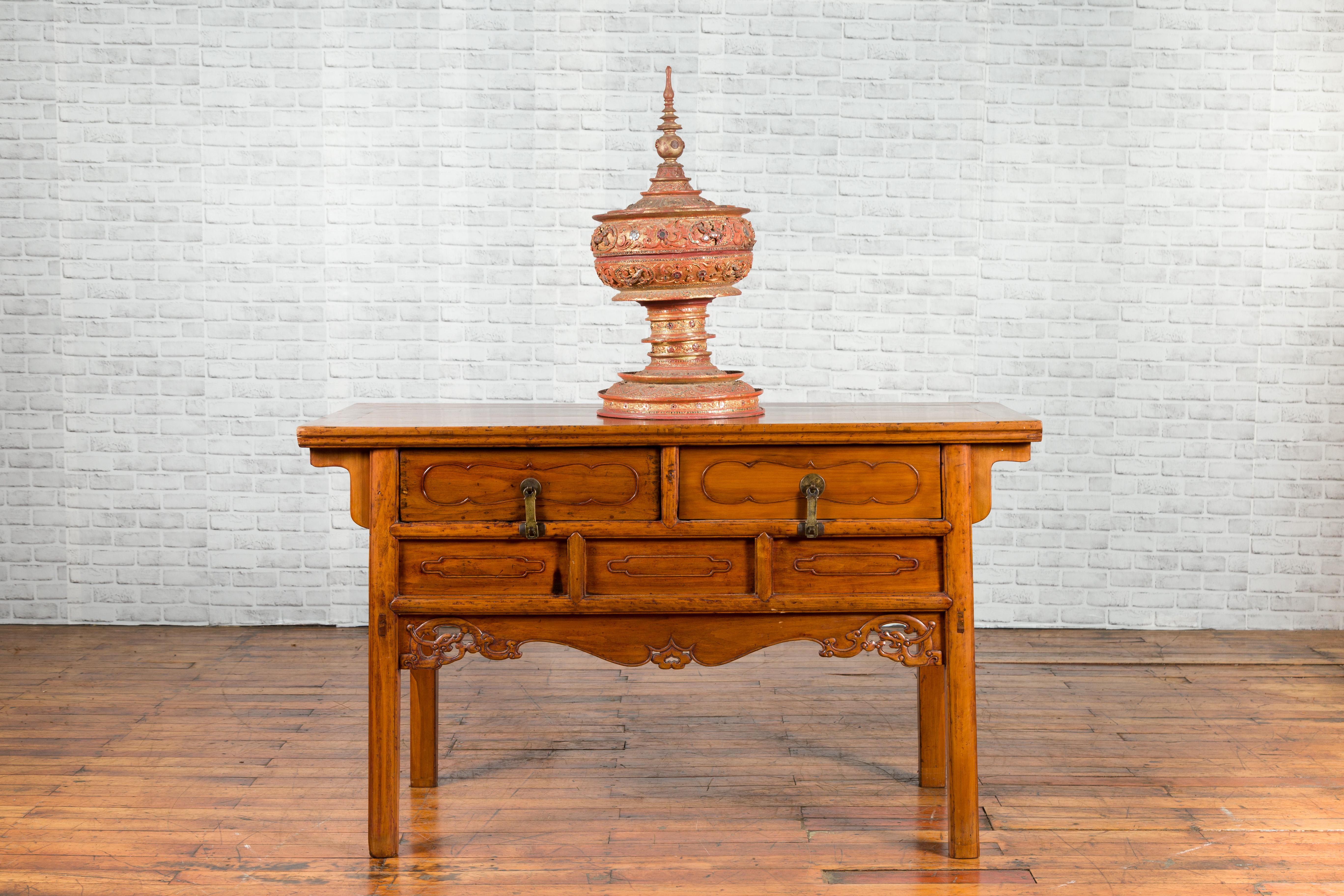 A Chinese Qing Dynasty period elm sideboard from the 19th century, with two drawers and carved apron. Created in China during the Qing Dynasty period, this elm sideboard features a rectangular top with central board, sitting above a perfectly