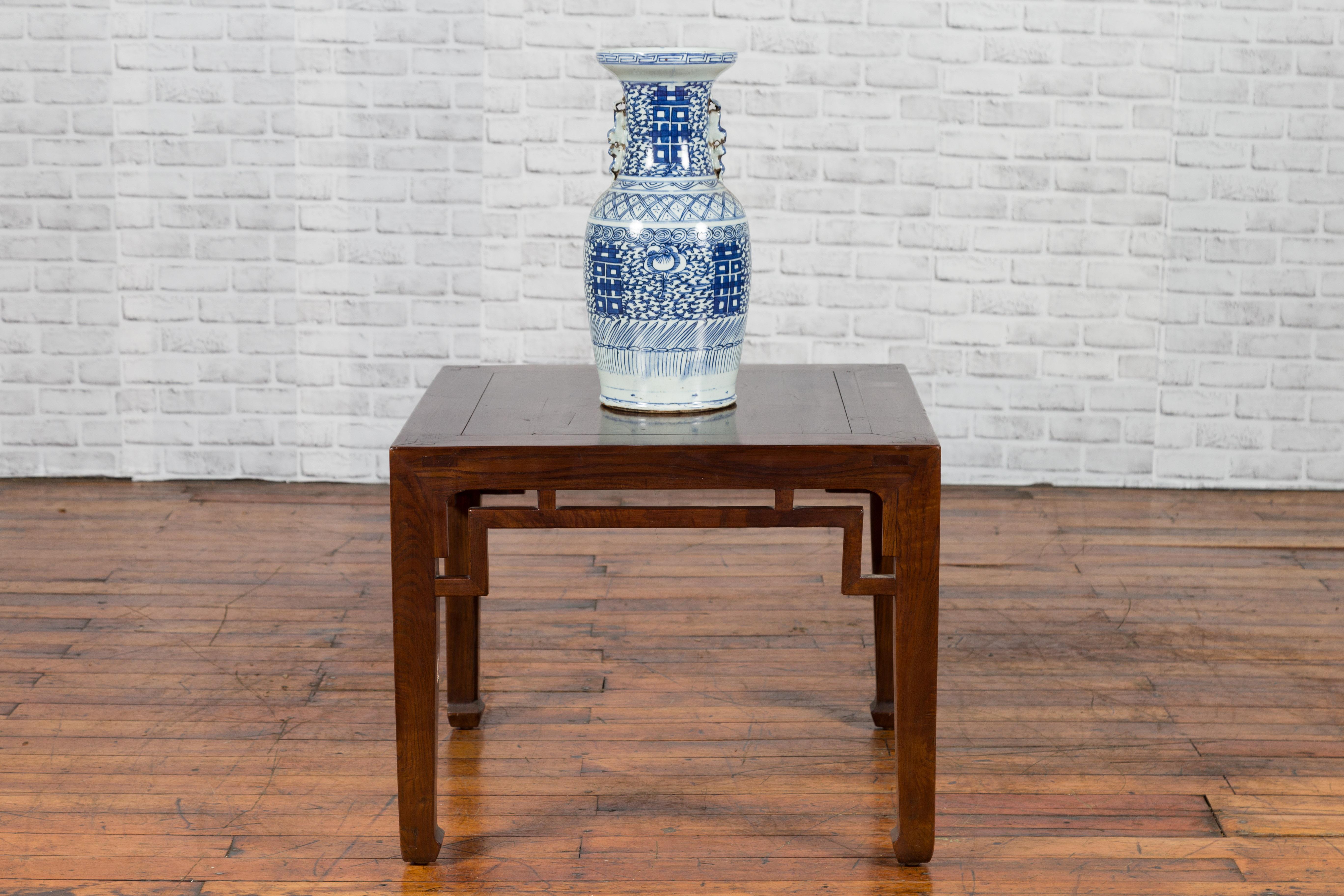 A Chinese Qing Dynasty period square-shaped side table from the 19th century, with horsehoof extremities. We currently have two available, priced and sold $1,500 each. Created in China during the Qing Dynasty, this side table features a