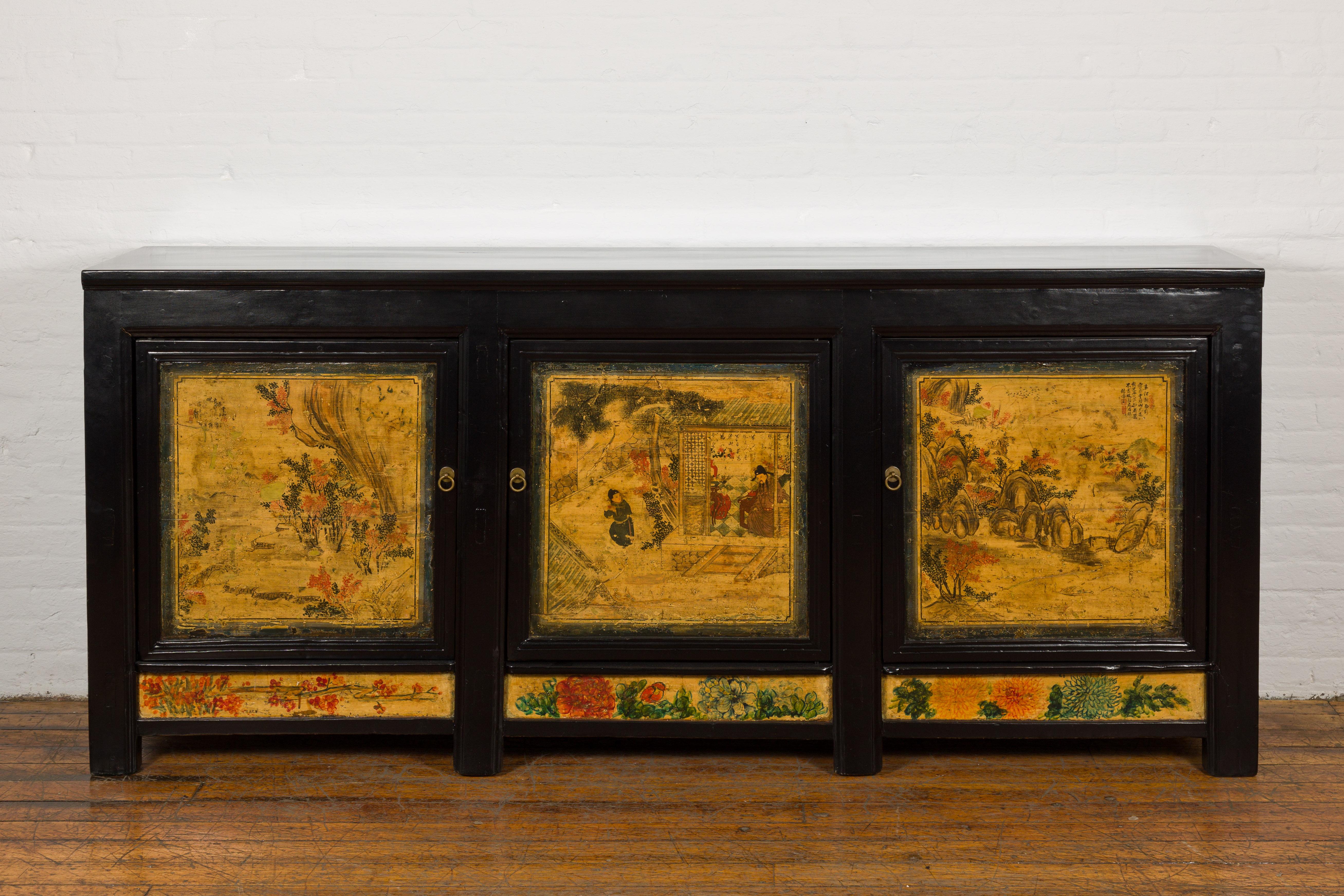 A Chinese Qing Dynasty period long and large enfilade from the 19th century with black lacquer and hand-painted scenes, newly refinished with custom lacquer. Introducing this exquisite Qing Dynasty Enfilade from the 19th century, a superb piece of