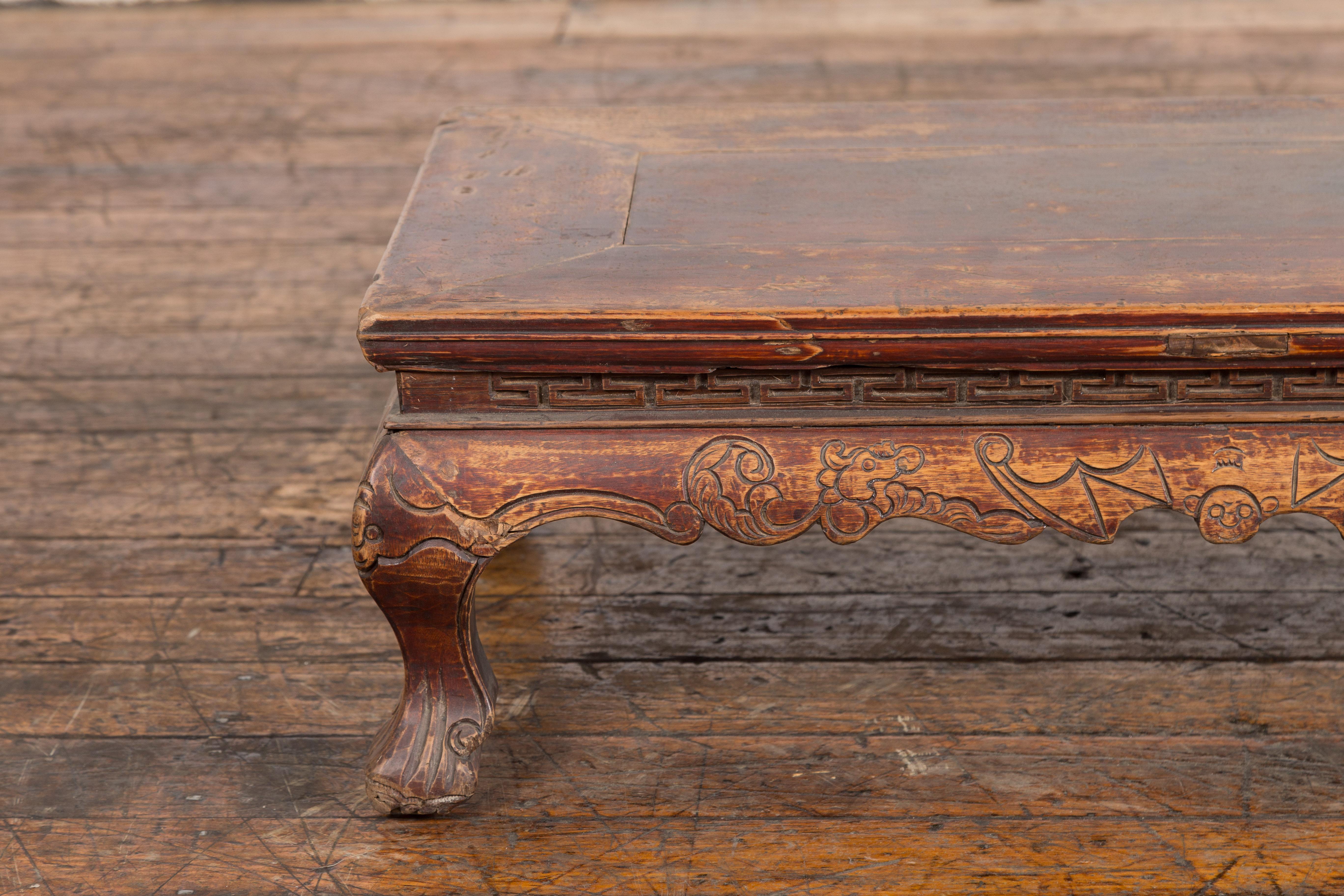 Wood Chinese Qing Dynasty Period Low Kang Table with Carved Bats and Cabriole Legs For Sale