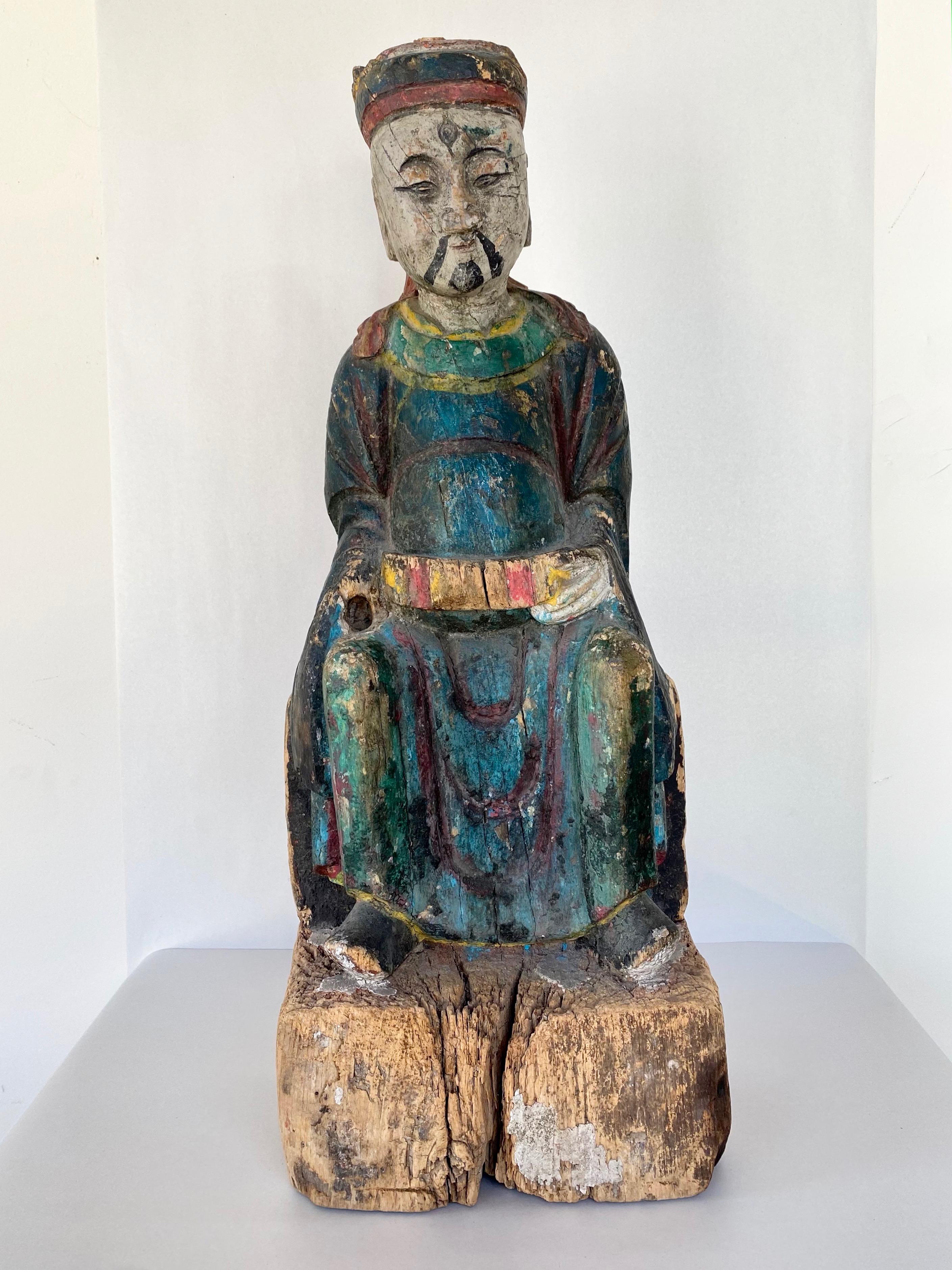 A Chinese Qing dynasty hand-carved wooden statue of a royal sage with original polychrome finish. Attributed to the Ming dynasty circa 1640 by a previous gallery, though overall look and Jian Ding certified export seal suggest that it more likely