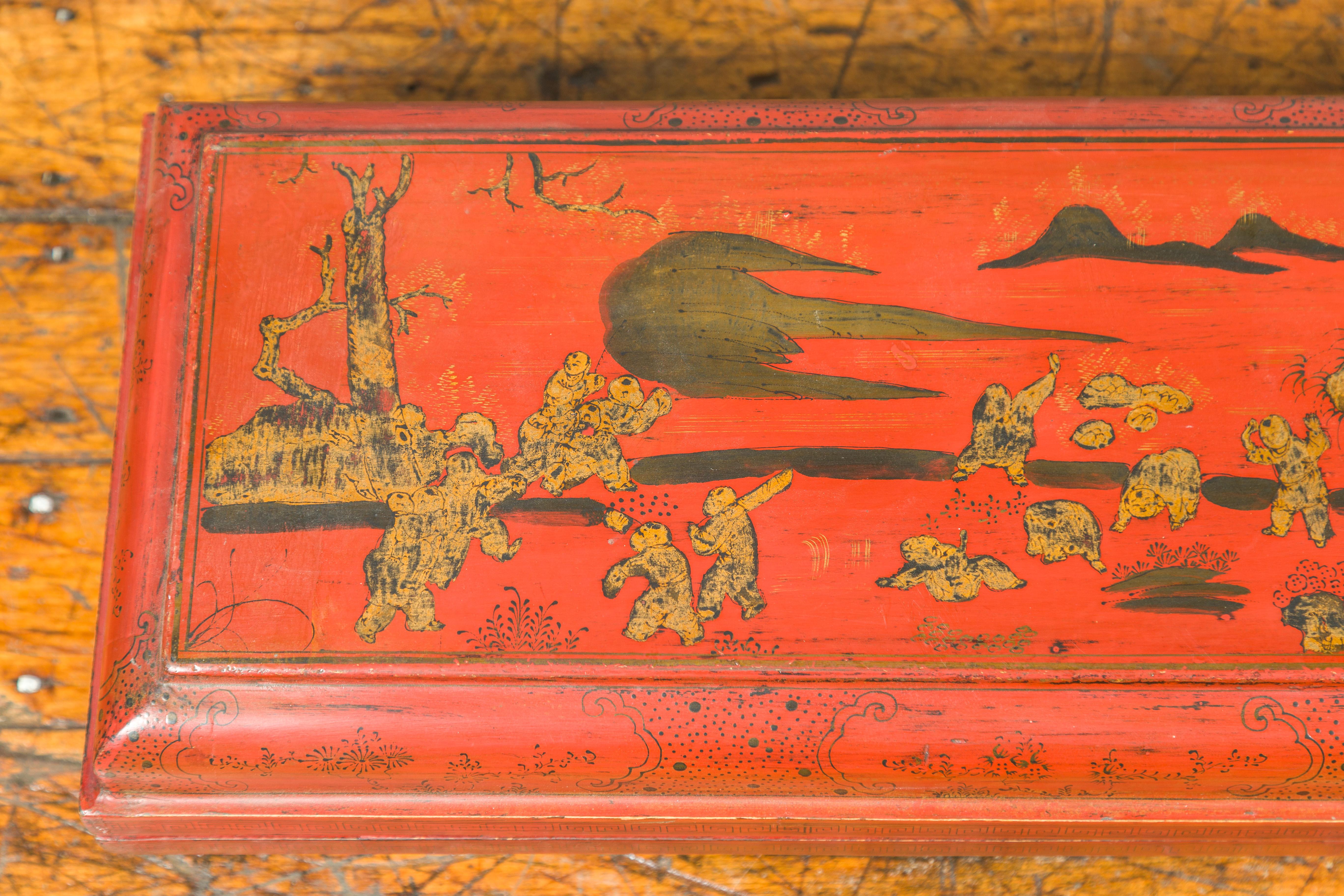 Gilt Qing Dynasty Red Lacquered Scroll Box with Distressed Gold Chinoiserie Décor For Sale