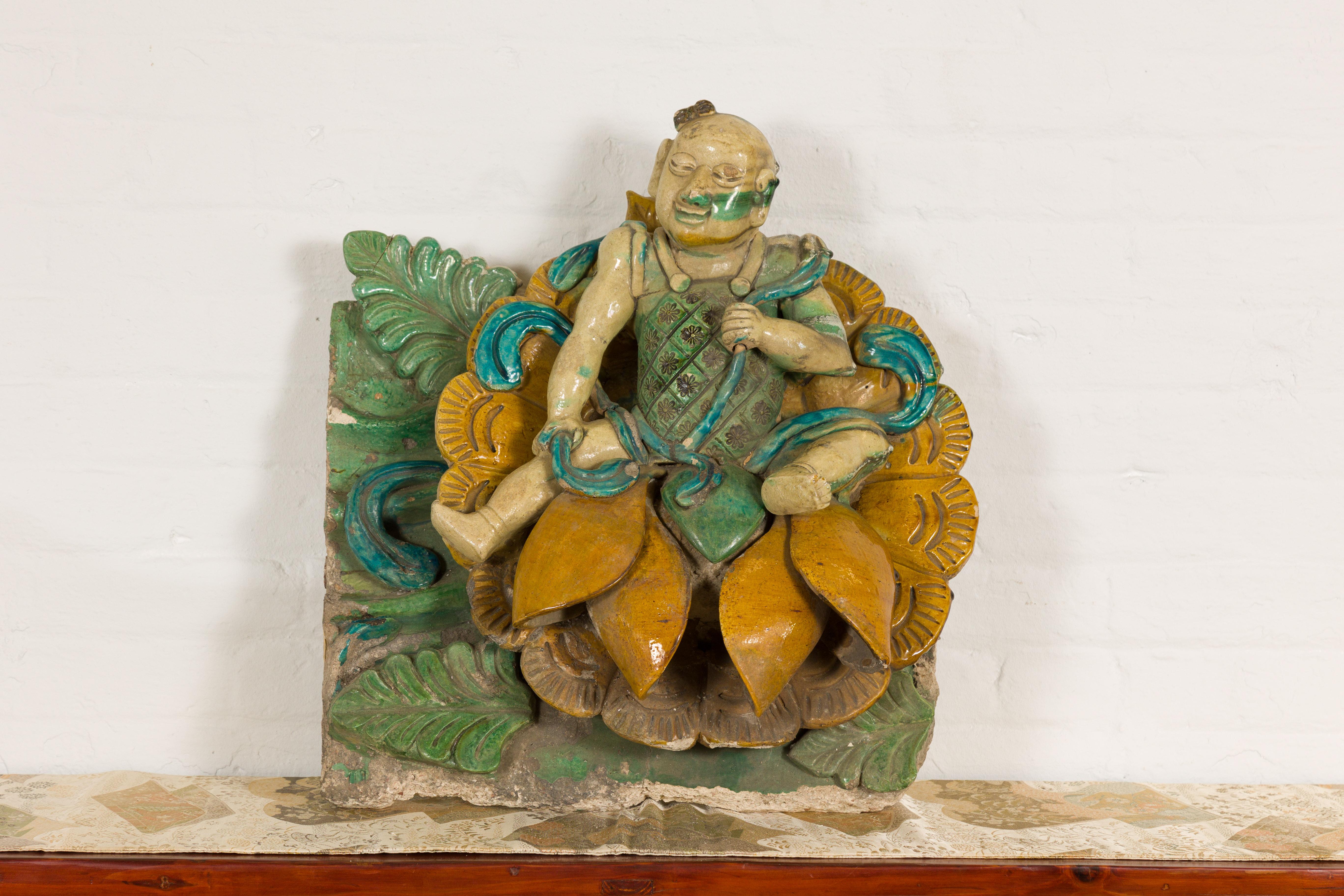 A Chinese Qing Dynasty period Sancai roof temple fragment from the 19th century with tri-color green, turquoise and yellow color and raised relief. Introducing an exquisite Qing Dynasty roof fragment, originating from a temple, beautifully presented