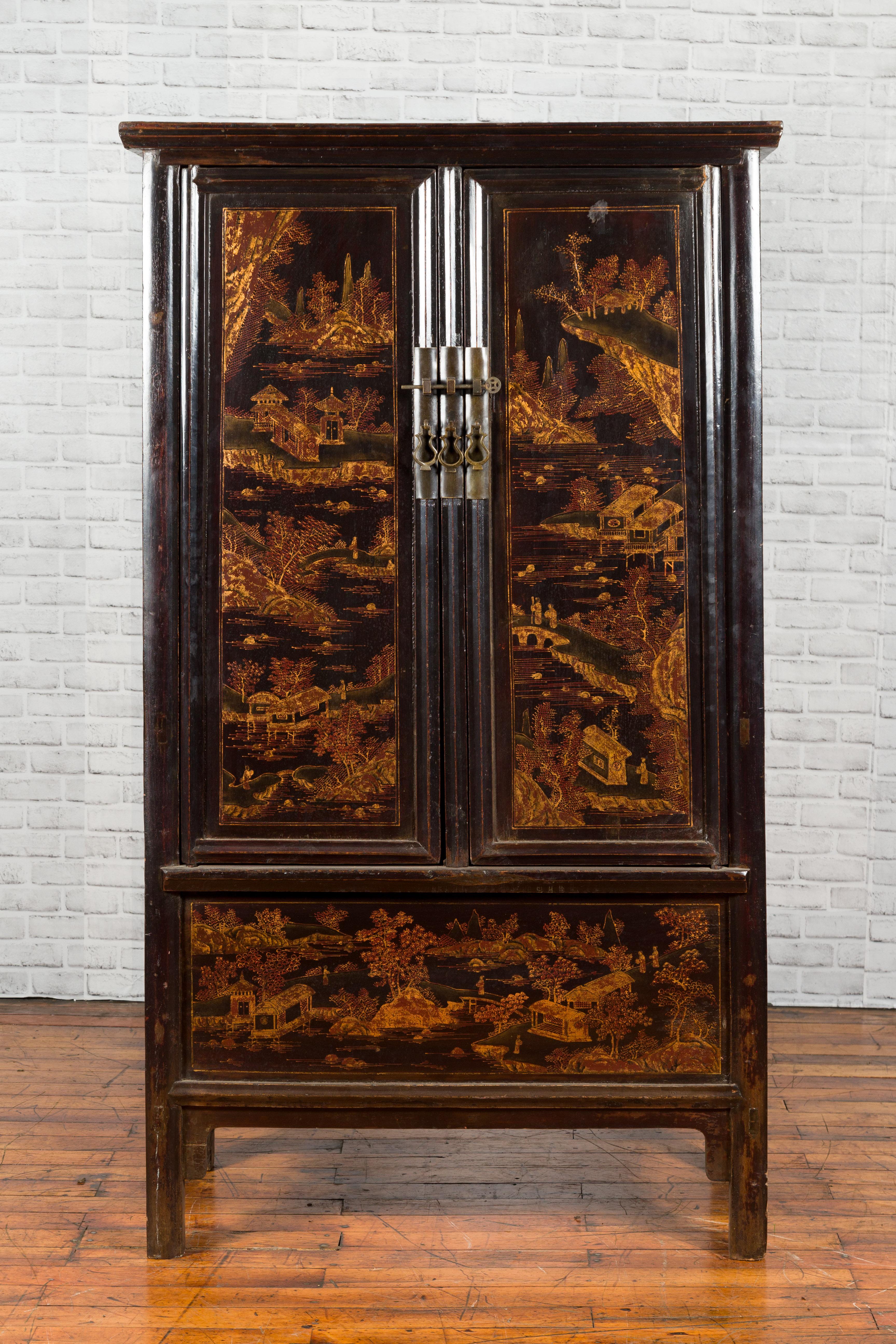 A Chinese Qing dynasty period Shanxi black lacquer cabinet from the 19th century, with chinoiserie decor and two hidden drawers. Created in the North-Eastern province of Shanxi during the Qing dynasty, this 19th century cabinet features a black