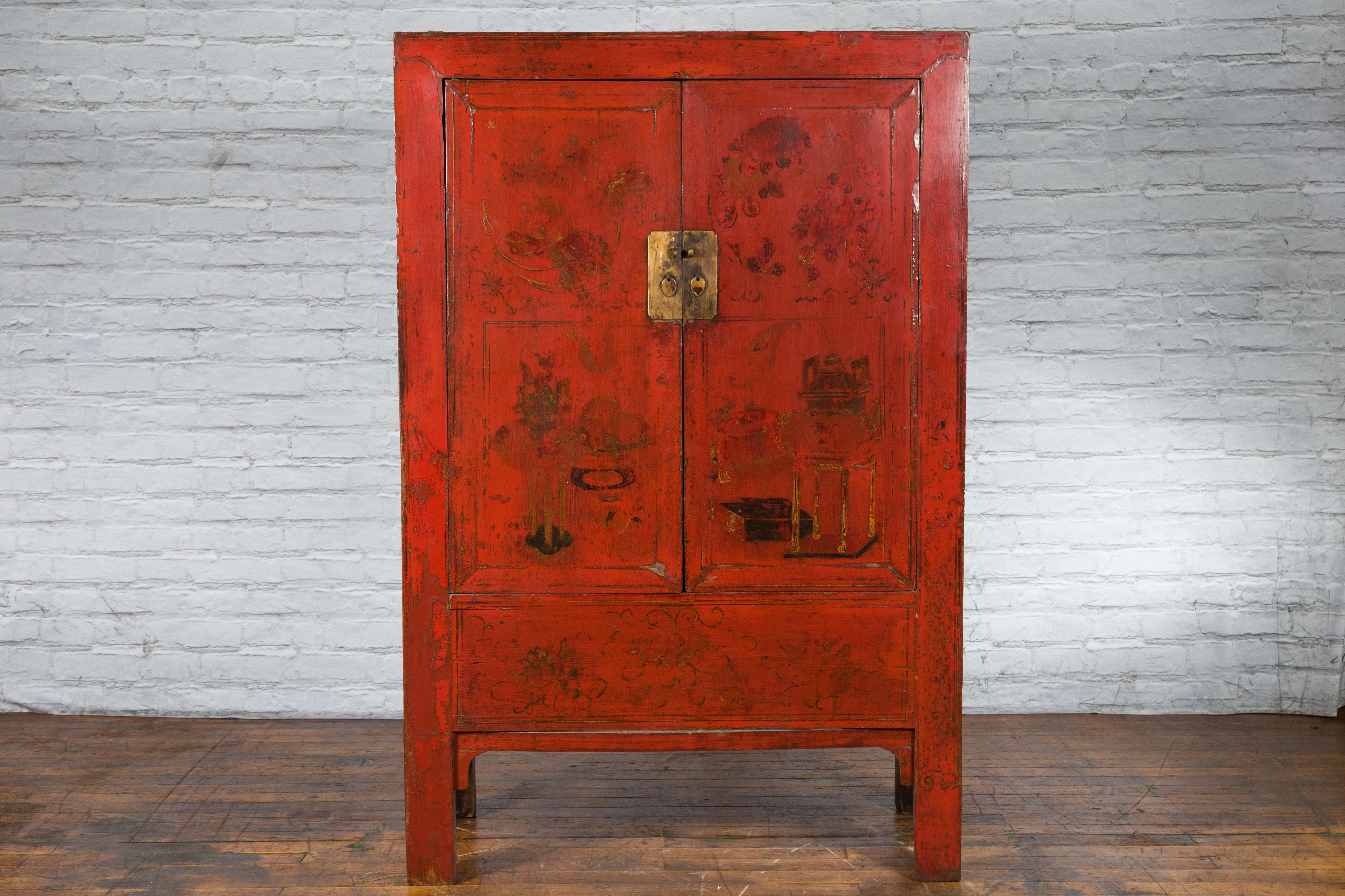 A Chinese Qing Dynasty period Shanxi wedding cabinet from the 19th century with original red lacquer and hand-painted floral décor. Created in the North-Eastern province of Shanxi during the Qing dynasty in the 19th century, this wedding cabinet