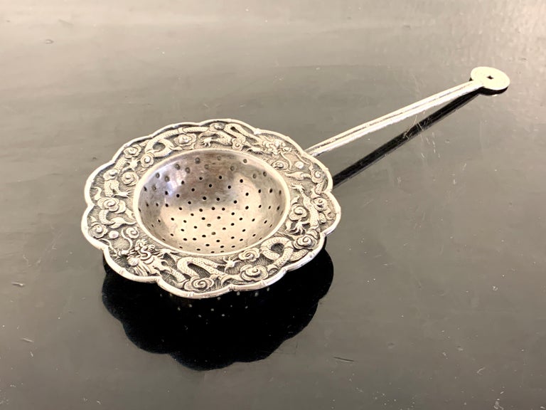 A wonderful Chinese silver tea strainer, Qing Dynasty, possibly Tong Zhi period (1861 to 1875), late 19th century, China. 

The silver tea strainer elegantly designed with a bamboo motif handled topped by a faux 