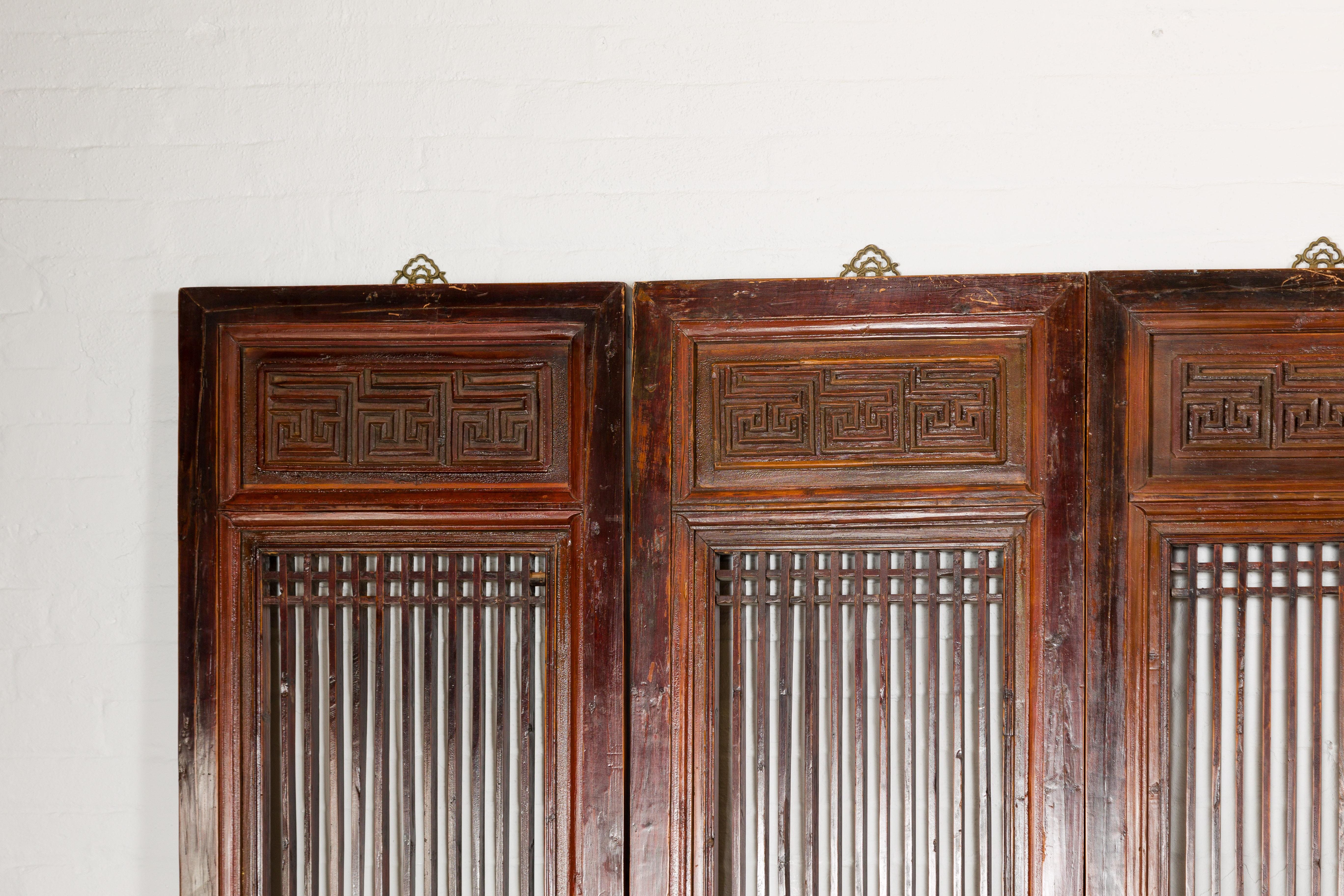 20th Century Chinese Qing Dynasty Six-Panel Lacquered Screen with Carved Meander Motifs For Sale