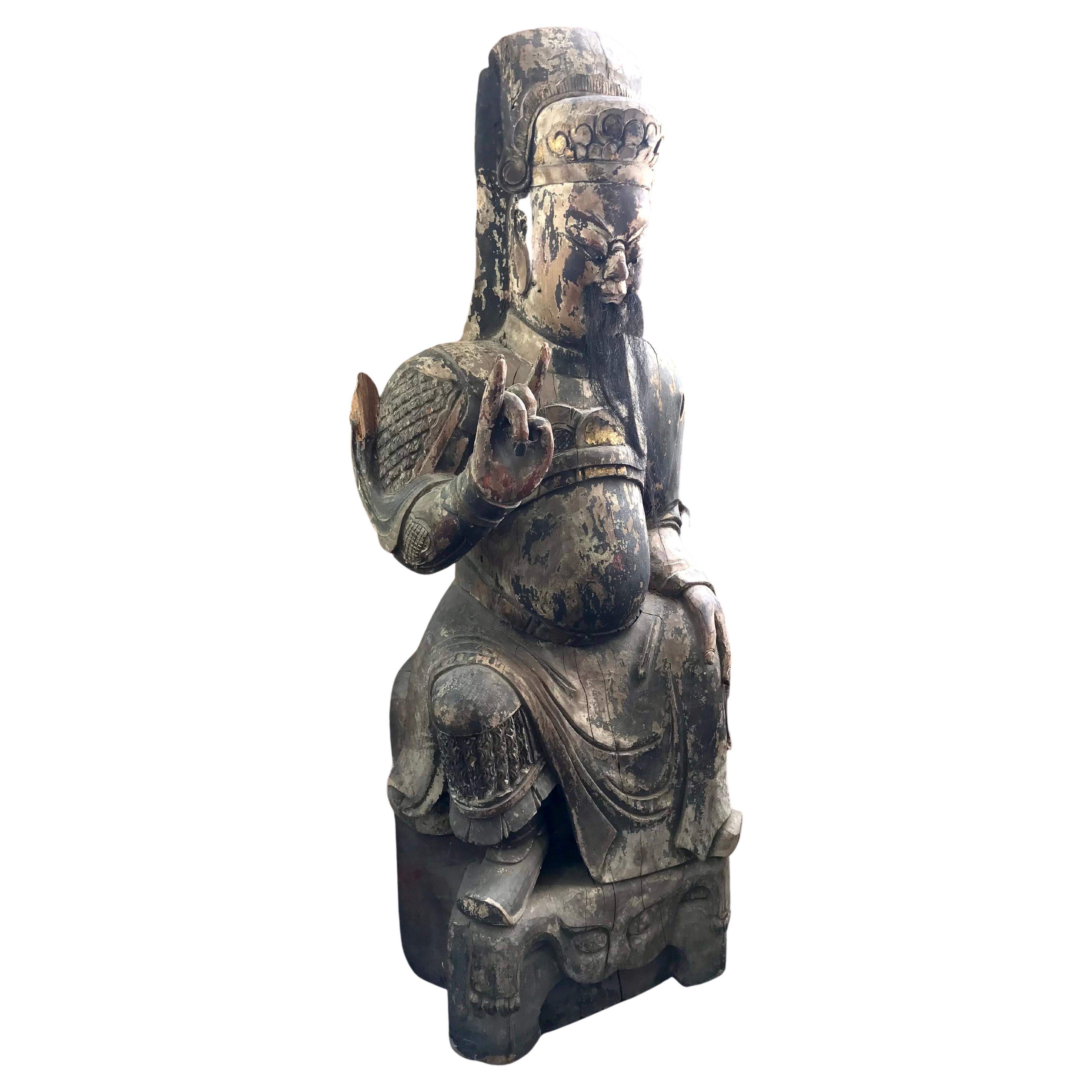 18th/19th Century Chinese Wood Sculpture Of A Emperor or General. Retains Some Polychrome Decoration And Horsehair Beard, Male Figure Seated On A Dais And Wearing Robes, 

Size: Height 45 Inches
Width 17 Inches
Depth 12 Inches 

Condition: