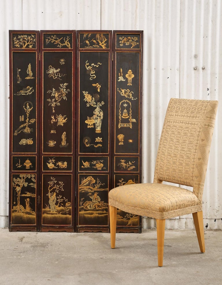 Rare unusual late 19th century/early 20th-century Chinese Qing four-panel coromandel screen. The front features dark red lacquer decorated with scholars objects and small landscape scenes in a parcel gilt finish. The opposite side features six