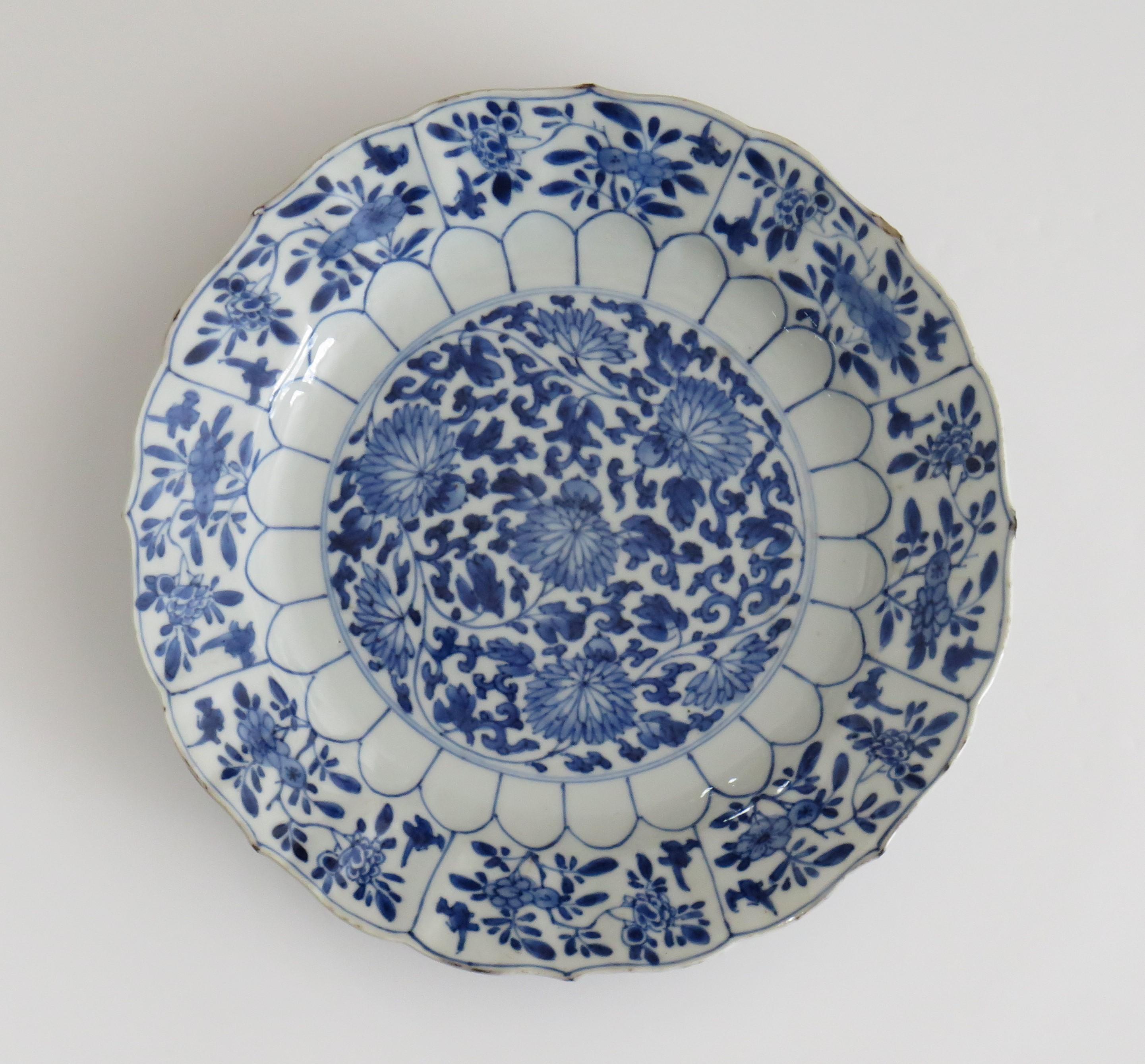This is a very beautiful hand painted blue and white Chinese porcelain deep plate or dish, dating to the second half of the 17th century, circa 1675, Qing dynasty, the early part of reign of Kangxi ( 1662 to 1722) period.

The plate is very well