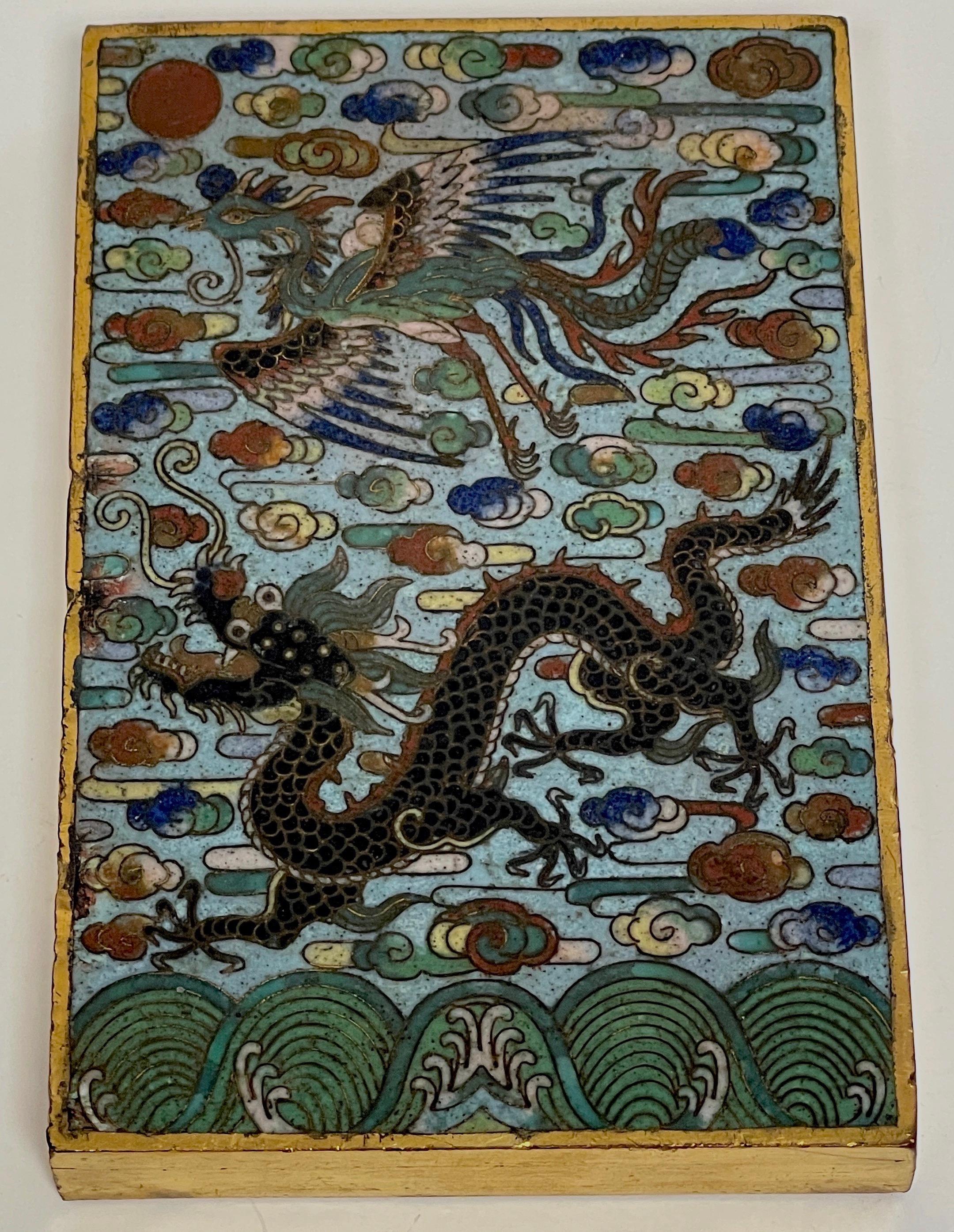 Chinese Qing Period gold plated bronze Cloisonné dragon & phoenix paperweight 
Qing Period, 19th century or older
Exceptional cloisonné work depicting the dragon and phoenix, representing emblems of emperor and empress. This is a very dense and