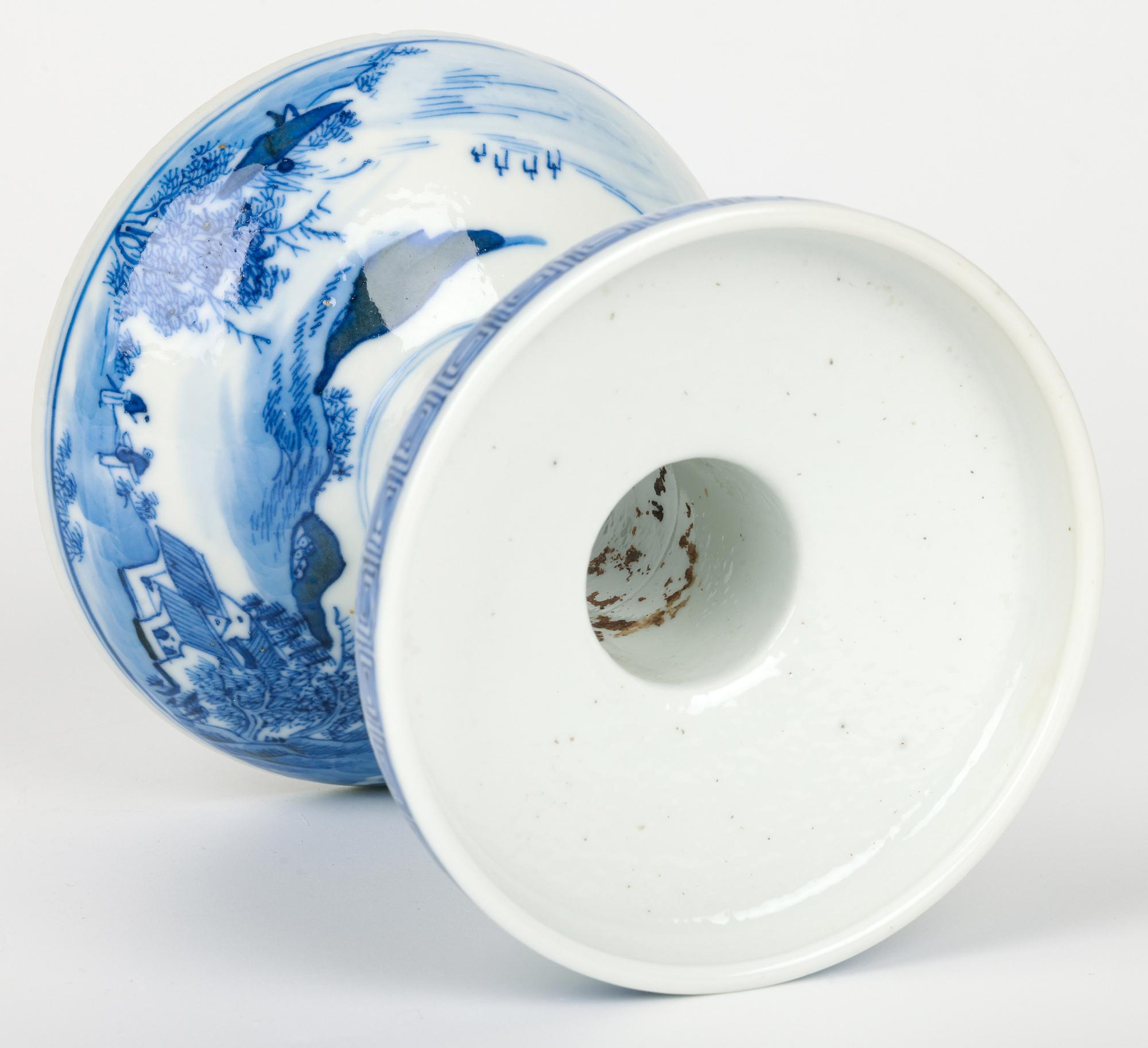 An attractive antique Chinese altar candle holder decorated with a landscape and dating from around 1900. This stylish porcelain candle holder has a domed hollow base with an unglazed foot rim and with a funnel shaped central stem and wide round top