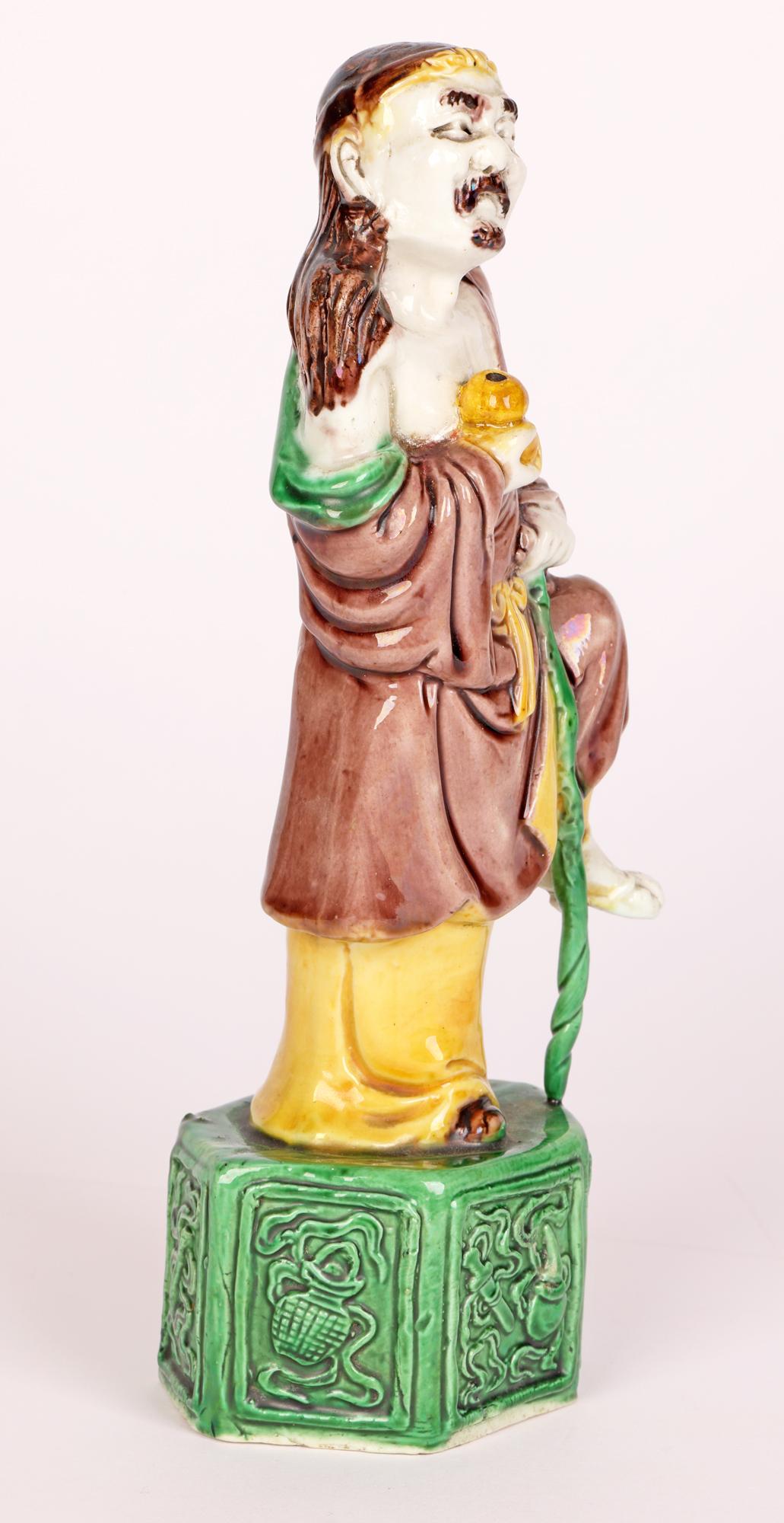 Porcelain Chinese Qing Sancai Glazed Immortal Figure For Sale