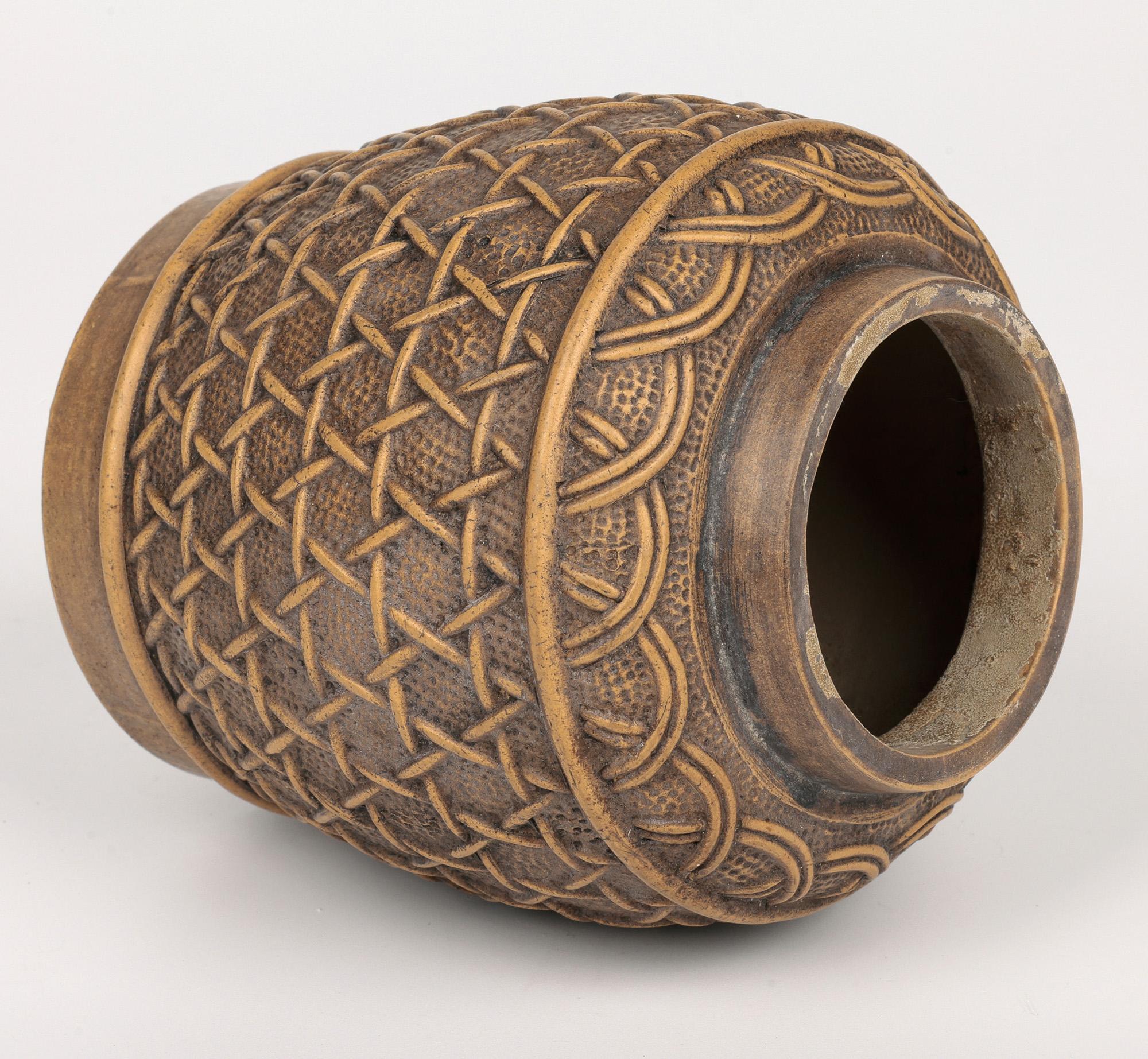 An unusual Chinese Qing, possibly Yixing, basket formed lidded container believed to date from the 19th century. The stoneware container stands on a narrow round foot with a recessed base and is of tall round basket shape with a narrow-raised rim