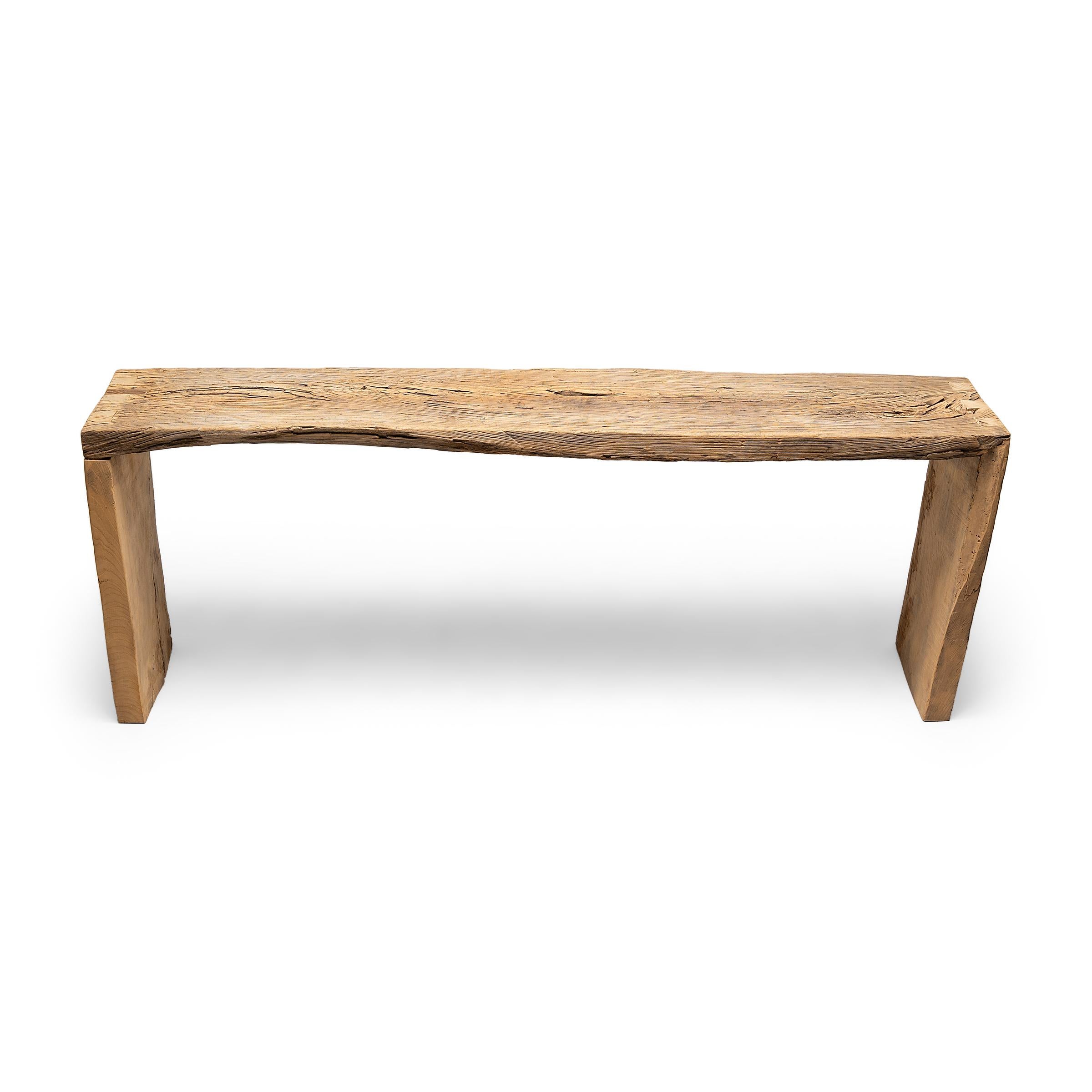 This contemporary console table is a celebration of wabi-sabi style. Crafted of wood reclaimed from Qing-dynasty architecture, the table has a minimalist waterfall design and is left unfinished to preserve the natural beauty of its materials.