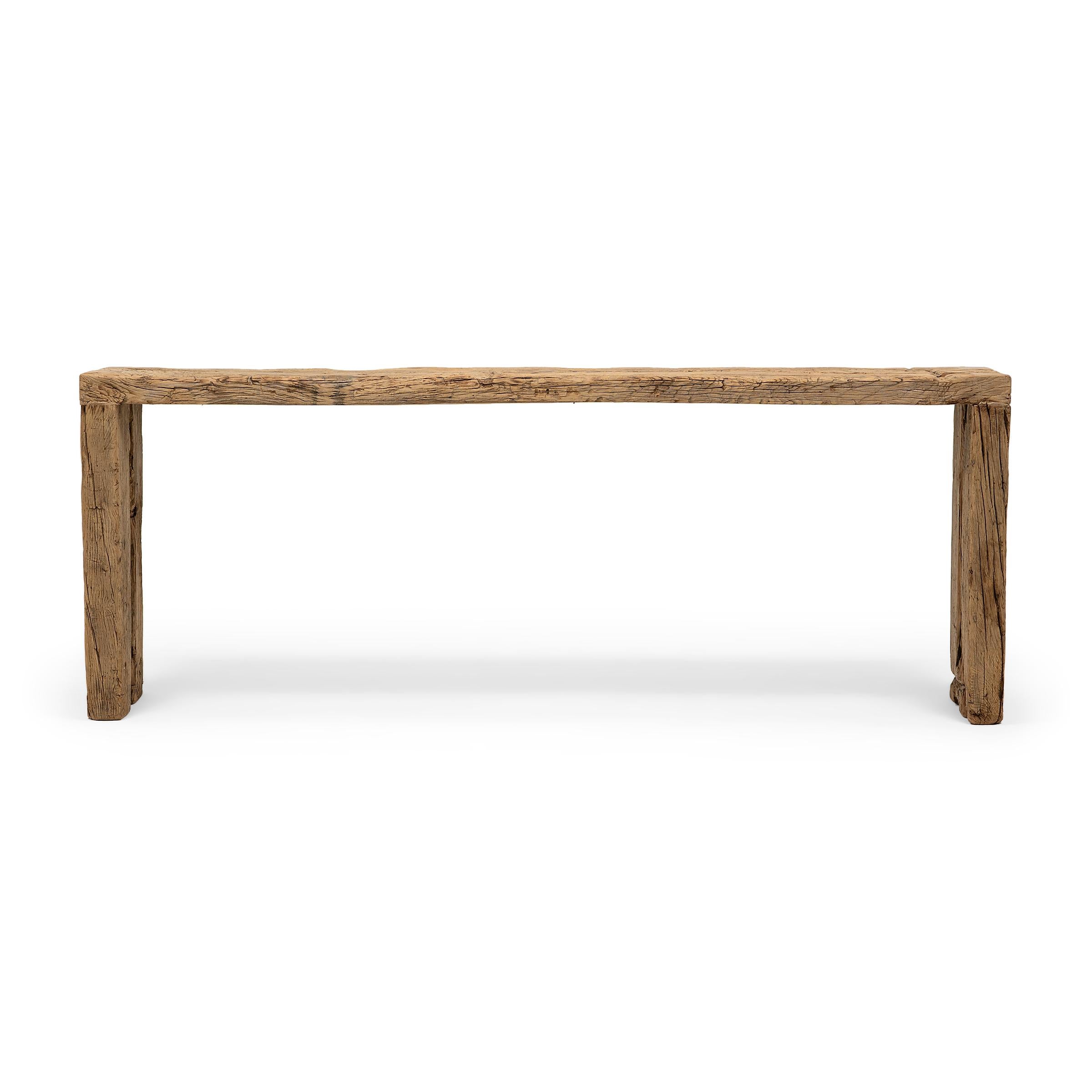 This artisan-crafted console table is a celebration of wabi-sabi style. Crafted of elmwood timbers reclaimed from Qing-dynasty architecture, the table has a minimalist waterfall design and is left unfinished to preserve the natural beauty of its