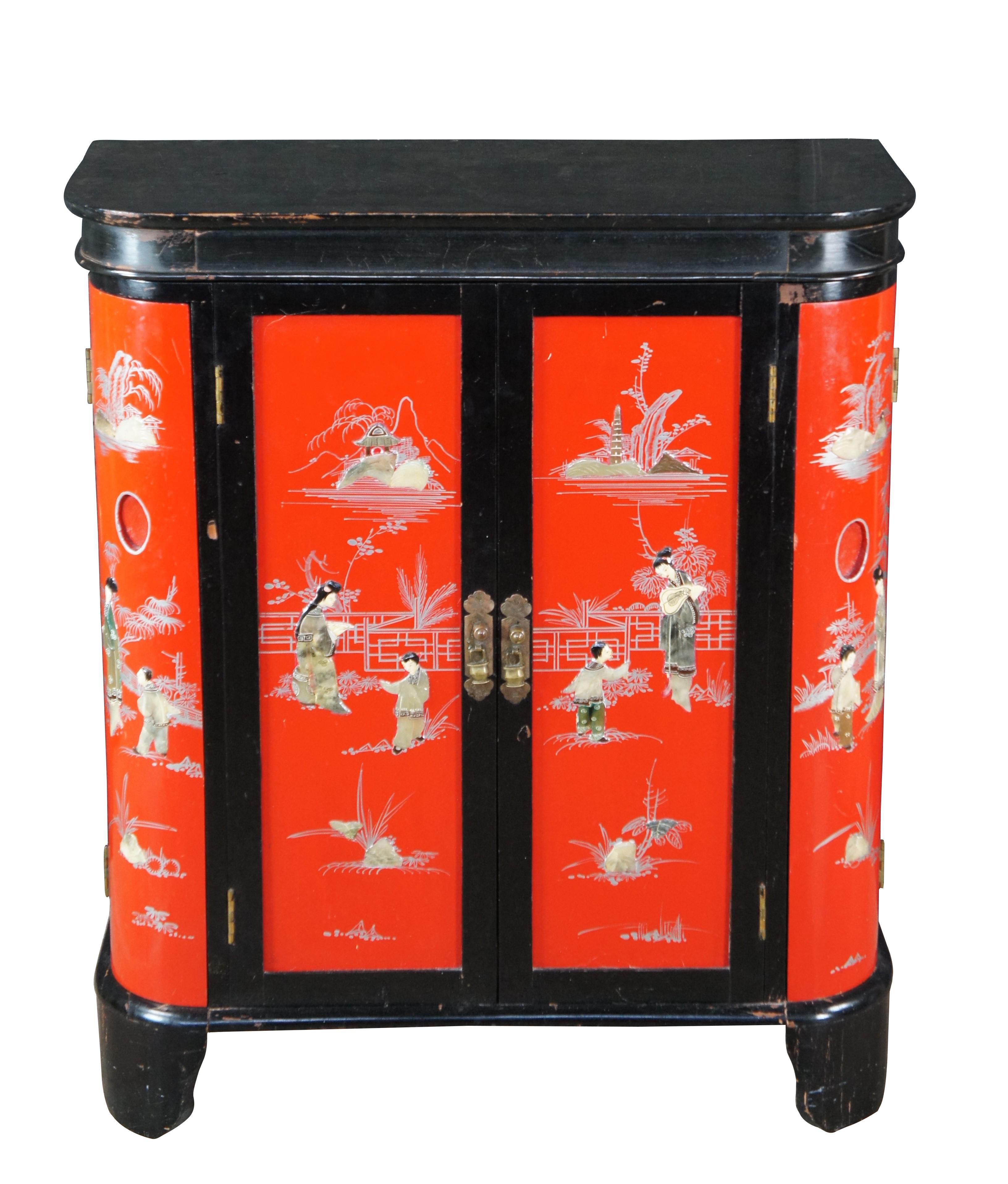 Mid 20th Century Chinese Red and Black Lacquer Soapstone Inlaid Dry Bar, circa 1960s.  Features a demilune form with flip top opening to a mirrored area for glassware and bottles as well as hanging glasses.  Lower section has a pullout with space