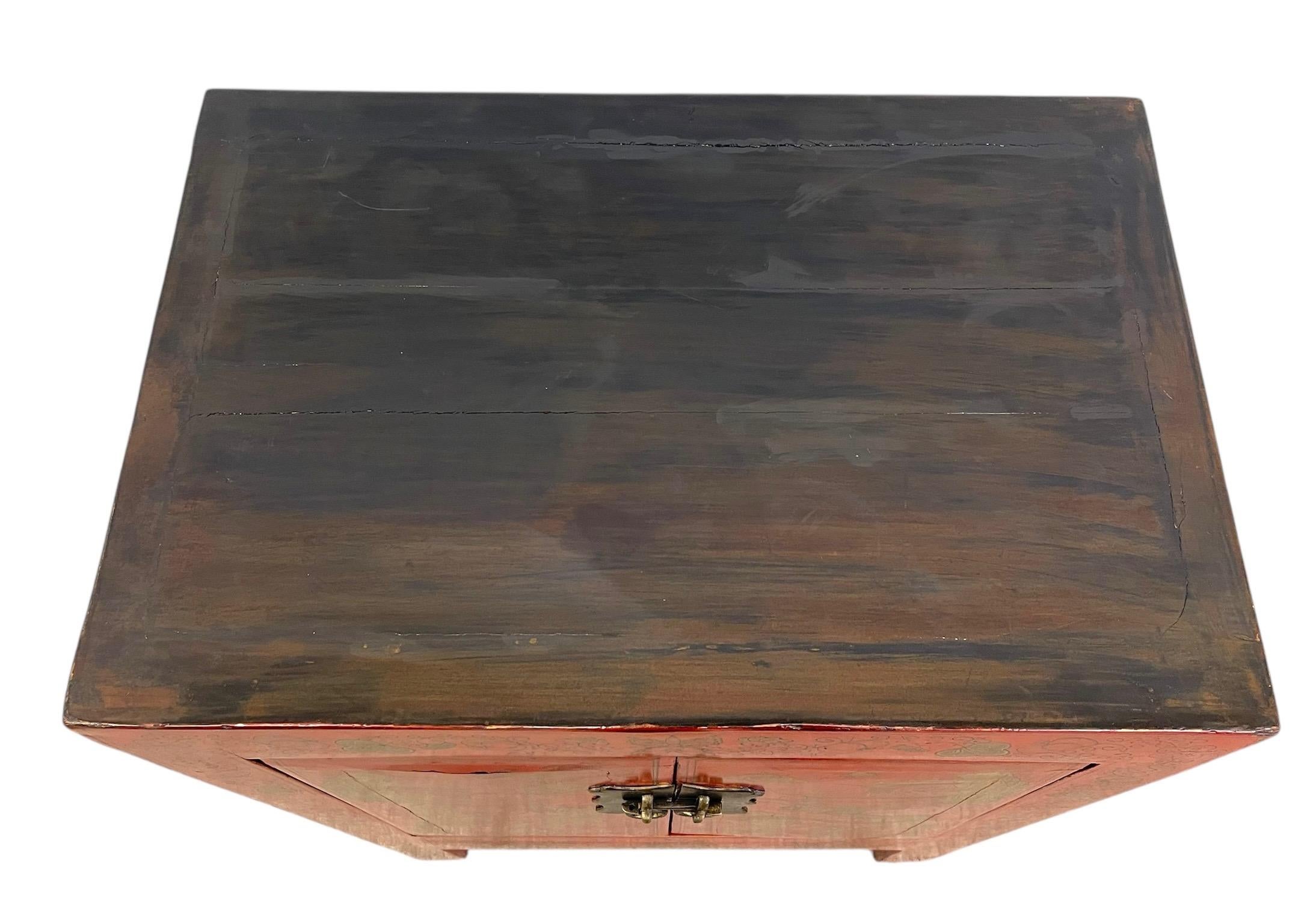 Wood Chinese Red Cabinet with Gilt Figural and Dragon Motifs For Sale