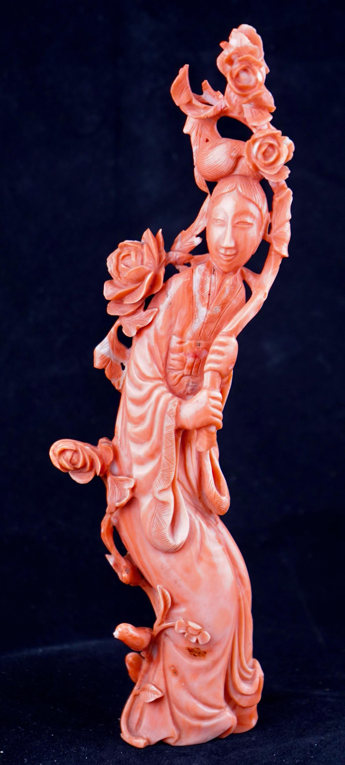 Chinese carved red coral lady with flowers and flowing robes. Very fine work from Qing Dynasty. Weight 145g.