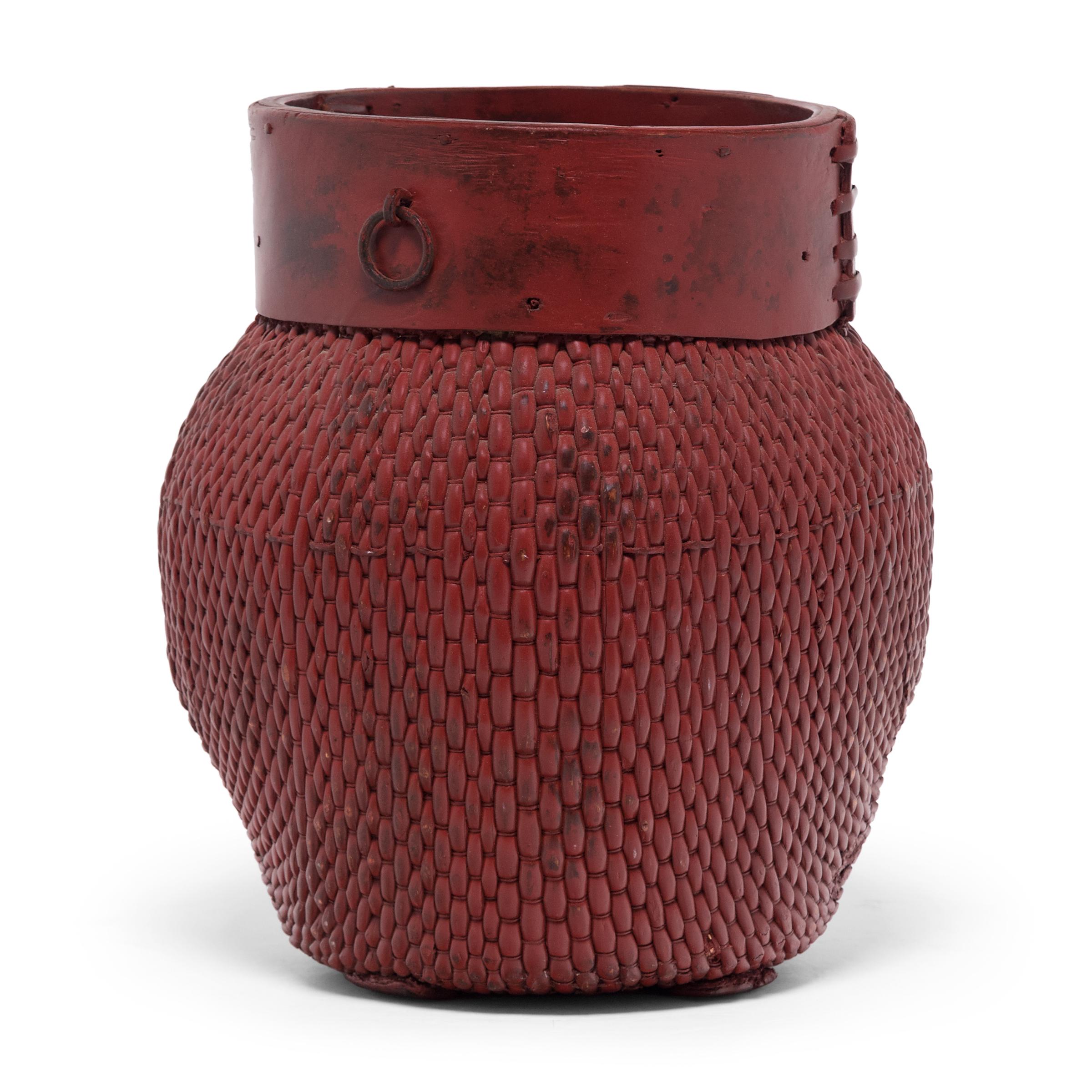 Basket-making is an ancient and humble craft, but in the hands of a skilled weaver a simple willow basket becomes a truly beautiful statement. This antique fisherman's basket is masterfully woven of flexible reeds and trimmed with a band of bent