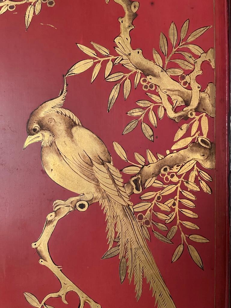 Painted Chinese Red Lacquer and Gilt Panel with Bird in a Tree, Black and Gilt Frame