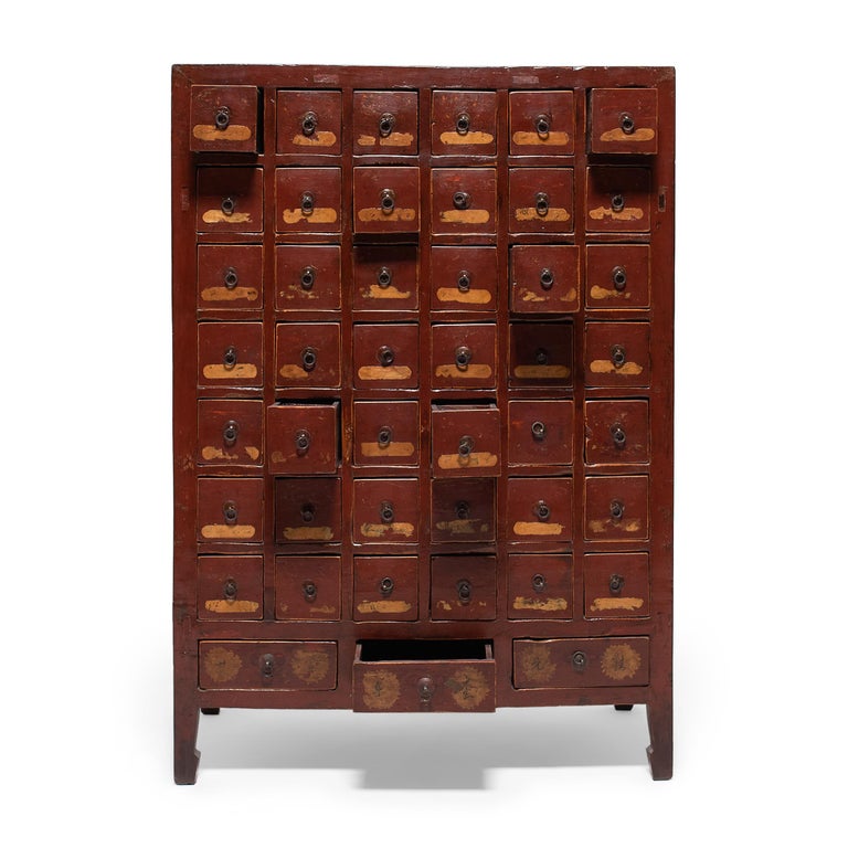 This 19th-century lacquered chest was originally used by a Chinese pharmacy to organize and store herbal medicines. A statement piece brilliantly constructed with mortise and tenon joinery, it has forty-five drawers, each fitted with three