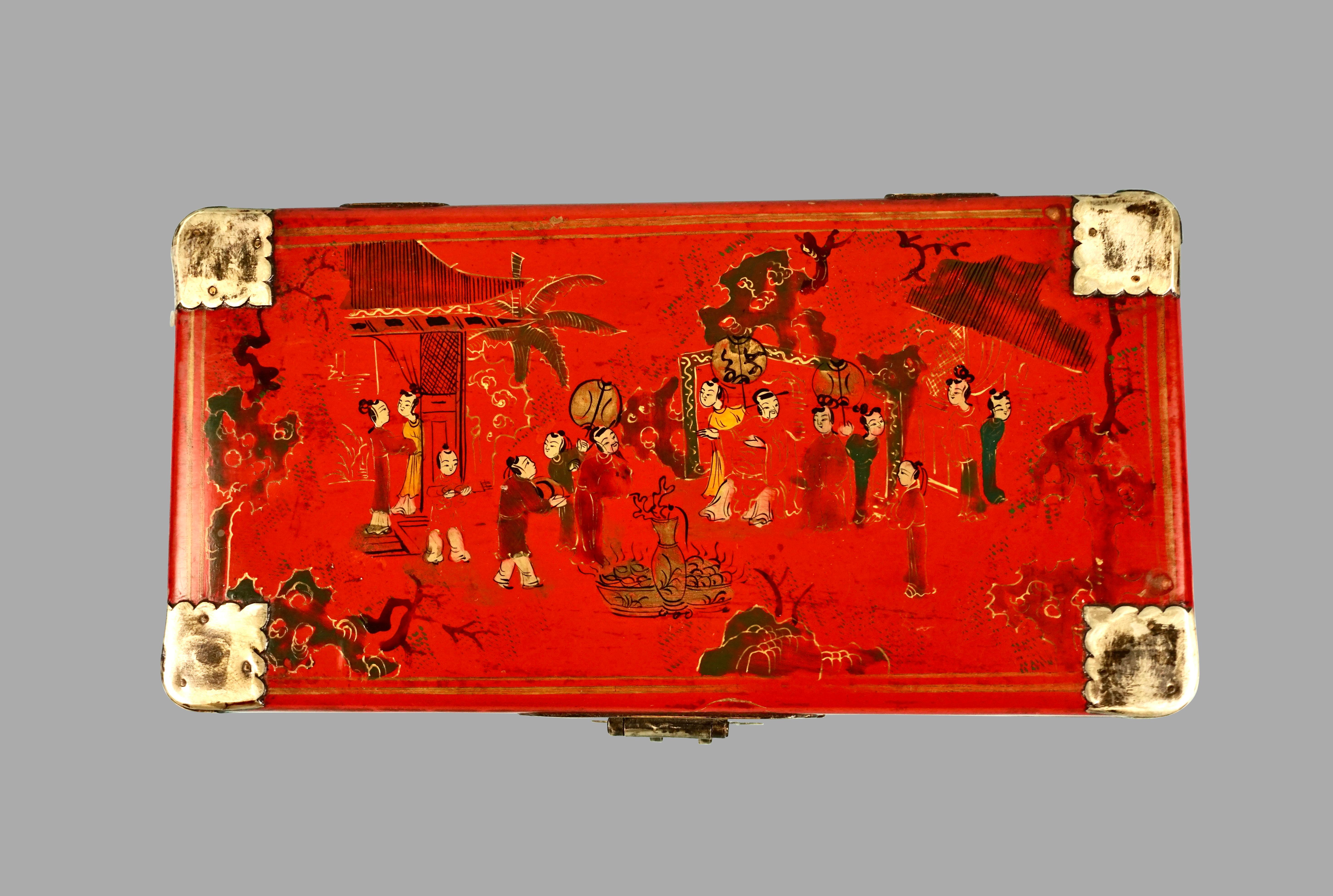 A Chinese red lacquer rectangular box with white metal mounted corners elaborately decorated overall with figures of men and women in an exotic setting.
Excellent quality in very good condition. Circa 1900-1930.