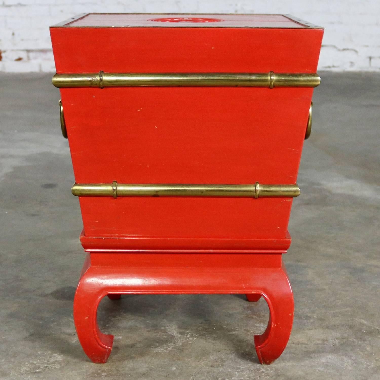 Handsome Chinese red lacquer and brass ice chest, planter, accent table with galvanized insert and lid on hoof foot style removable base. This piece is in wonderful vintage condition with a very nice age patina. One leg has a little more patina than