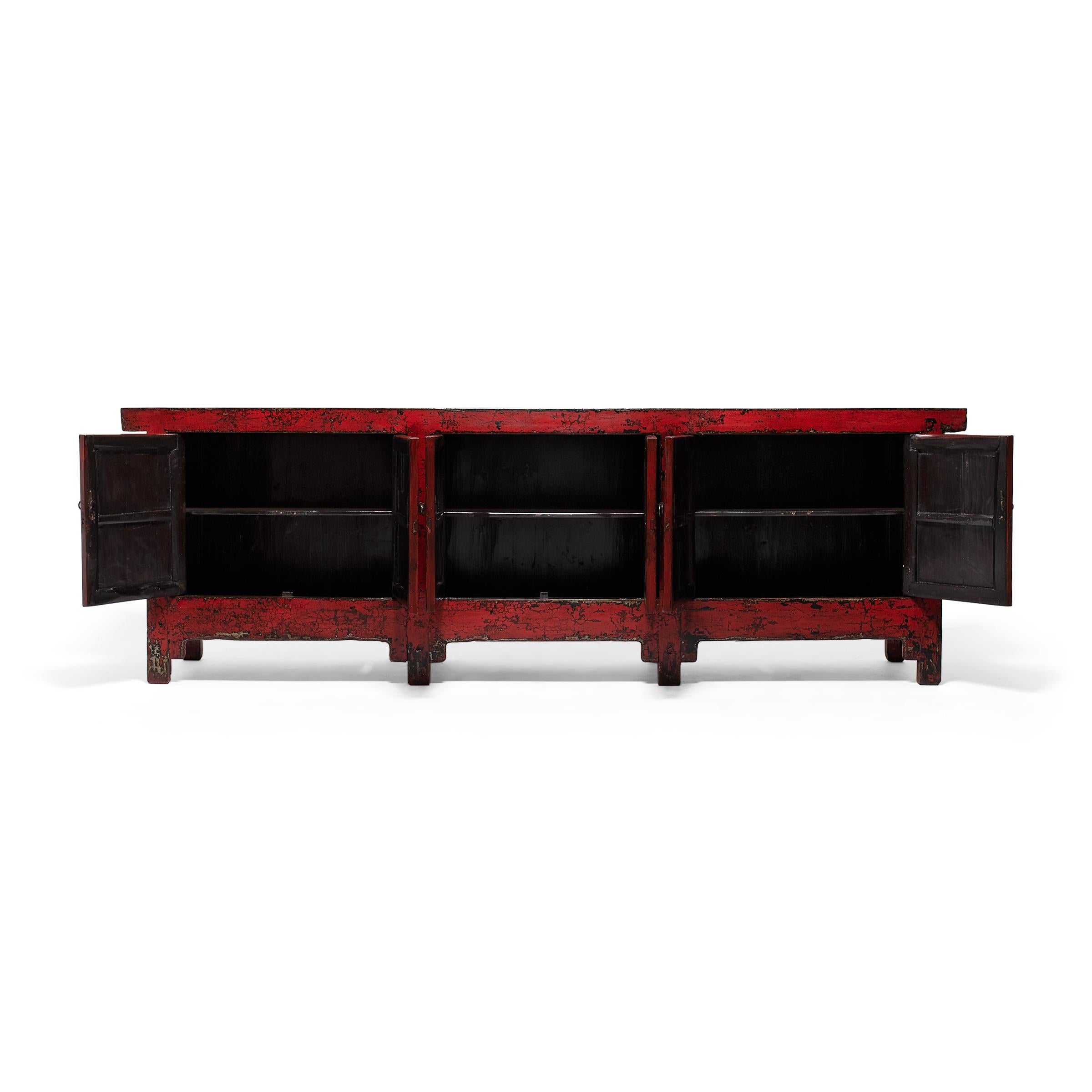 Created in the style of Mongolian storage coffers, this monumental sideboard combines the clean lines of modern furniture design with the weathered textures of rustic lacquerware. Originally configured to open from the top, the cabinet was modified