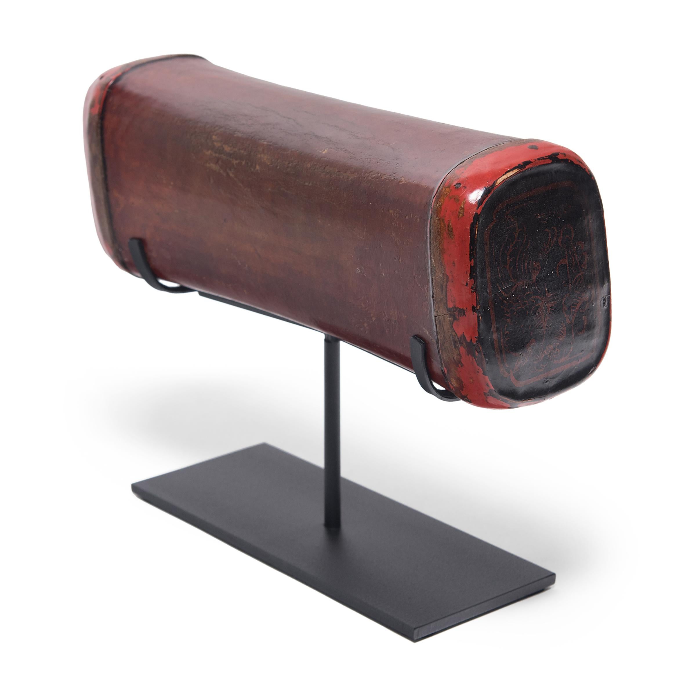 Crafted of painted, lacquered hide, this extraordinary headrest was created in China's Jiangxi province over 150 years ago. Its pliable design enabled contour comfort - quite luxurious for the time. Some scholars think the soft curve and height was