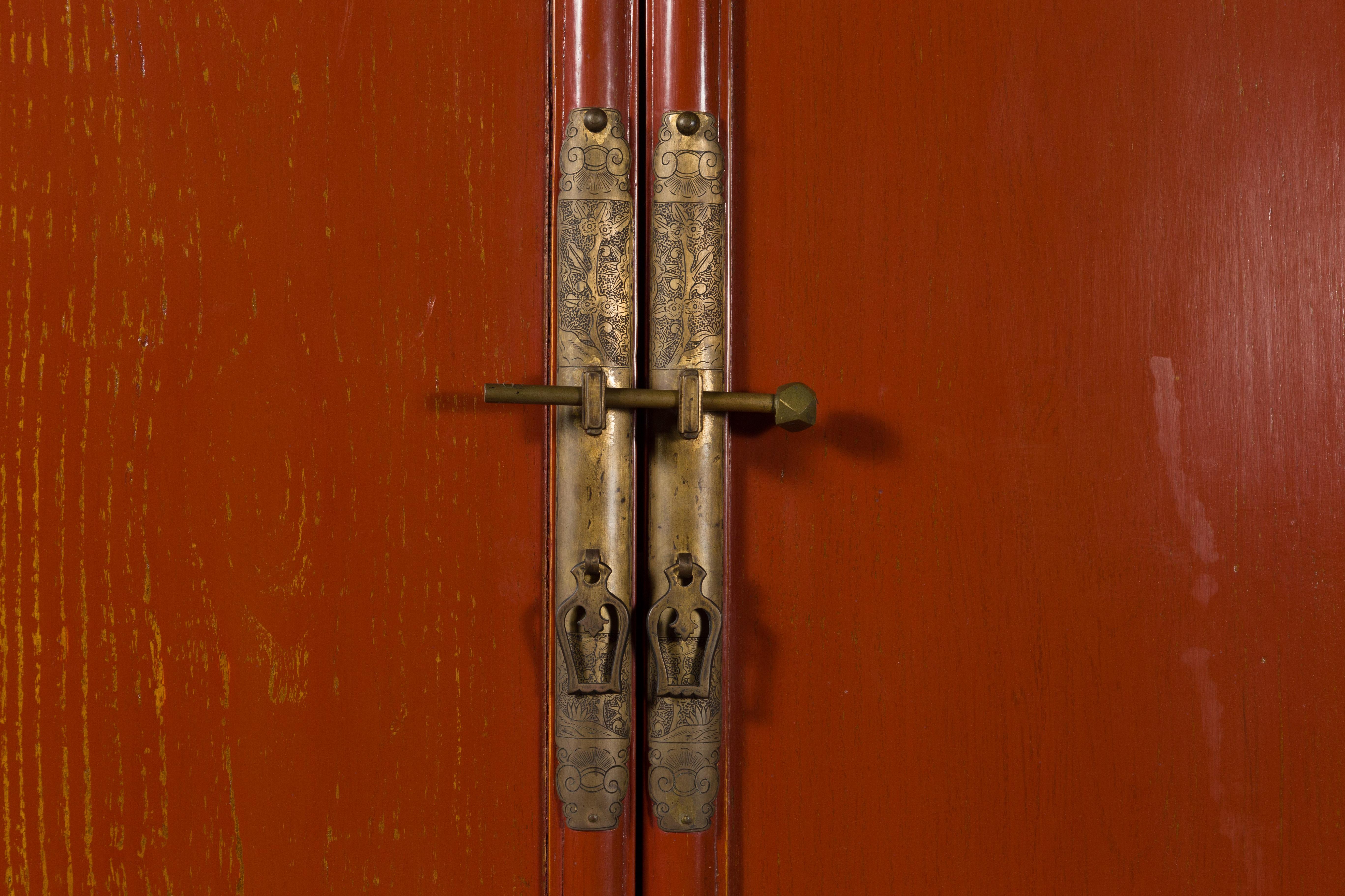 Brass Chinese Red Lacquer Ming Dynasty Style Cabinet with Floral-Carved Gilt Apron For Sale