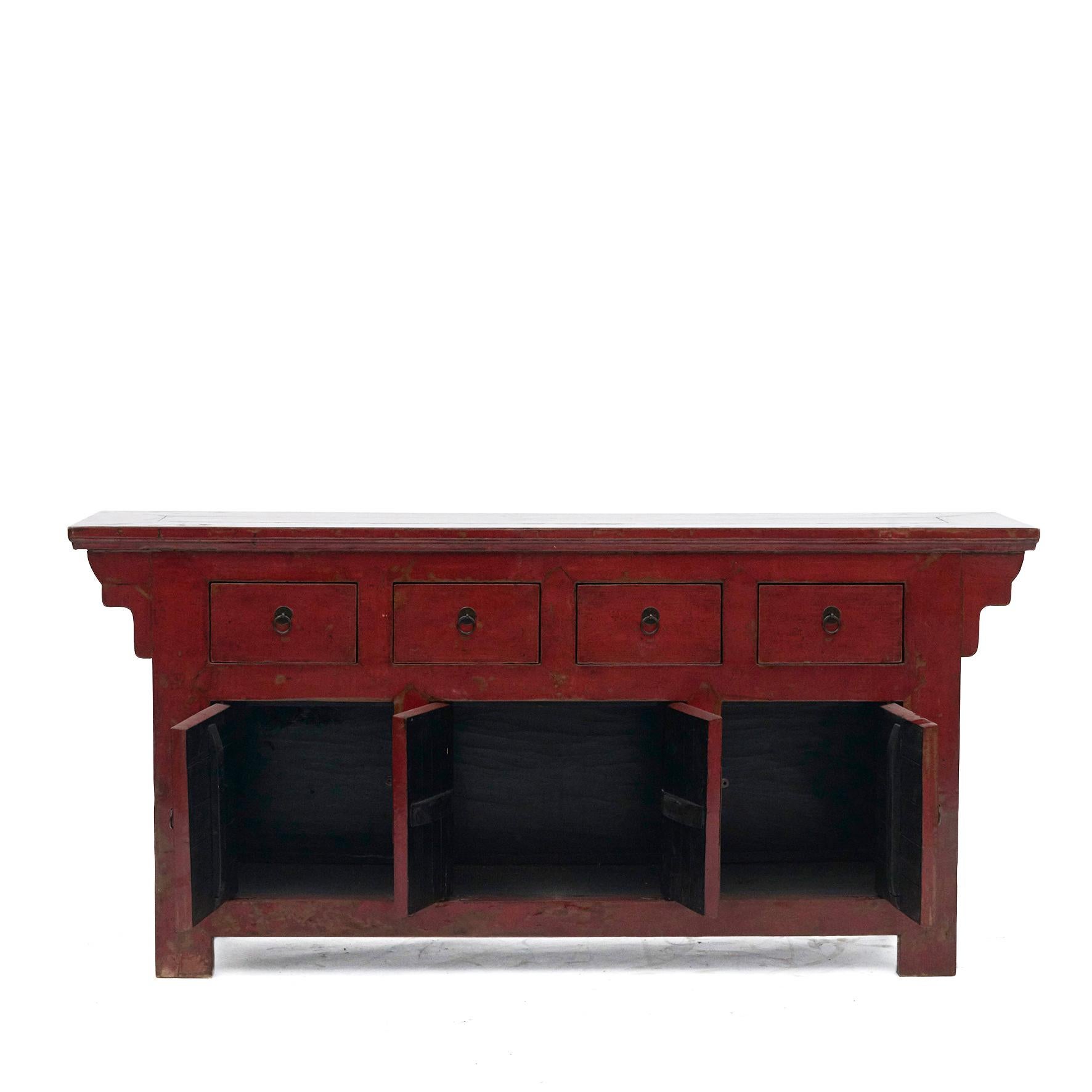A Qing dynasty elm and red lacquer sideboard from the Chinese province of Shanxi, circa 1850-1870.

With four drawers at the top and three lower compartments consisting of a double door with metal hardware flanked by set doors.

The original red